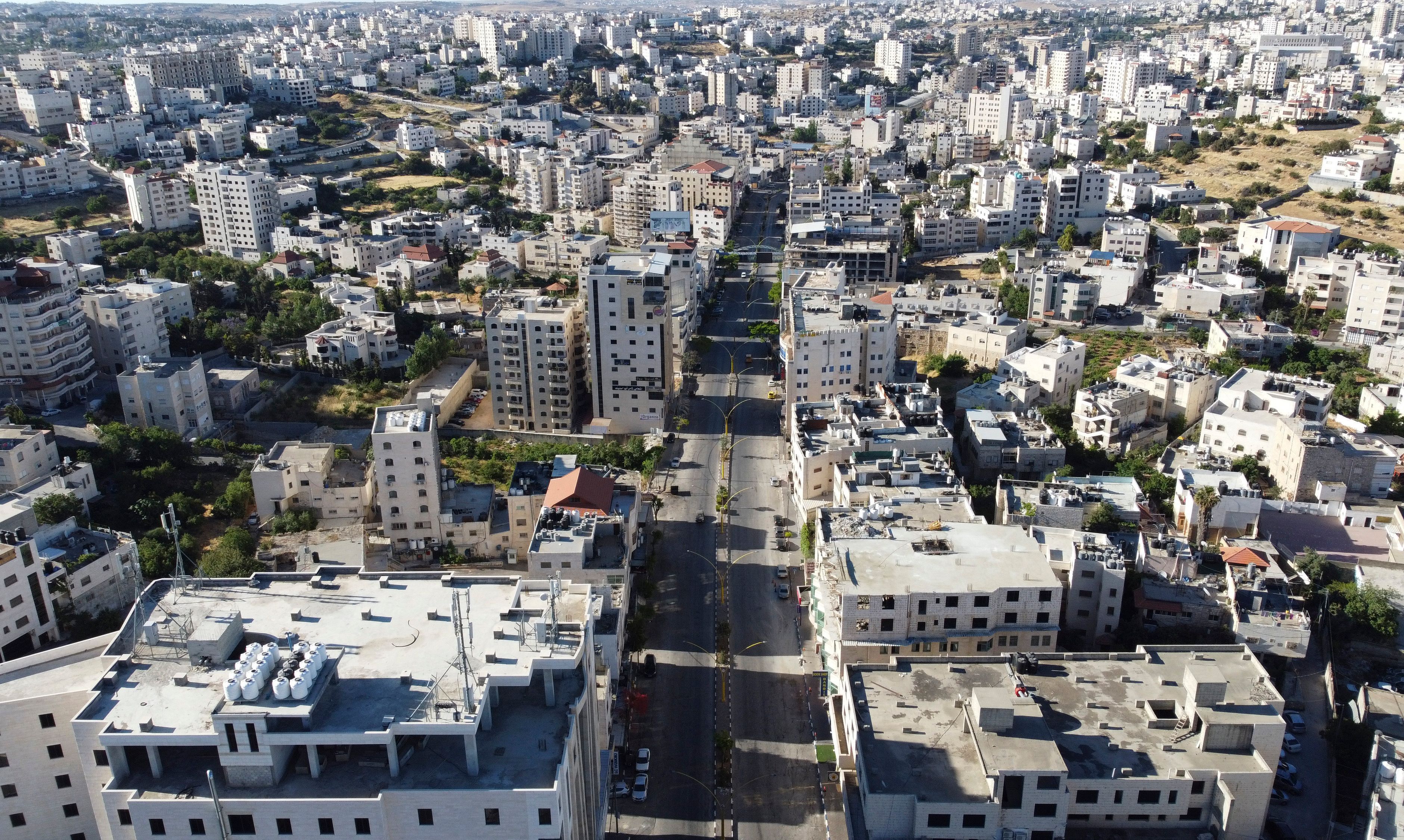 An aerial picture shows an empty main road in Hebron during a Palestinian general strike. 