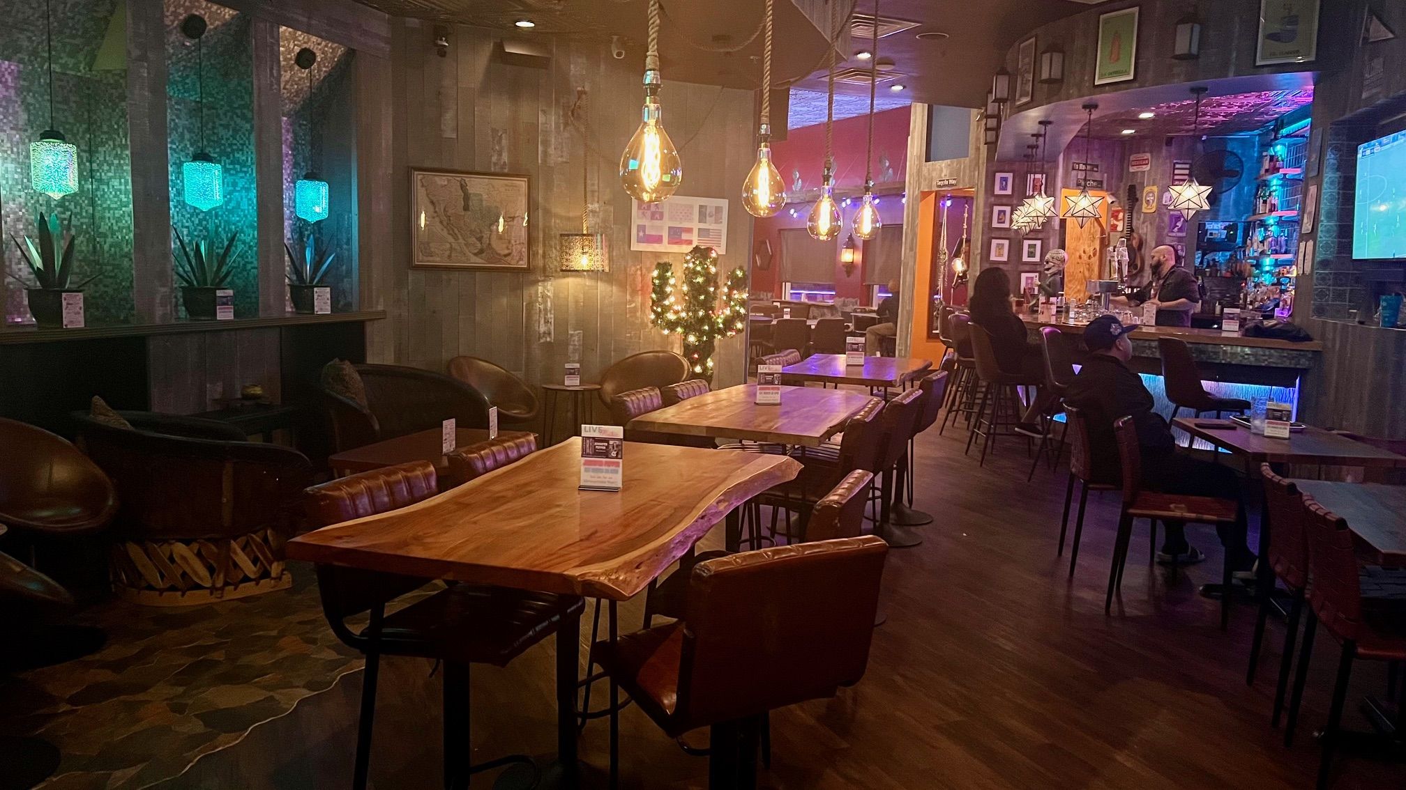 A lounge-like restaurant with neon lights 