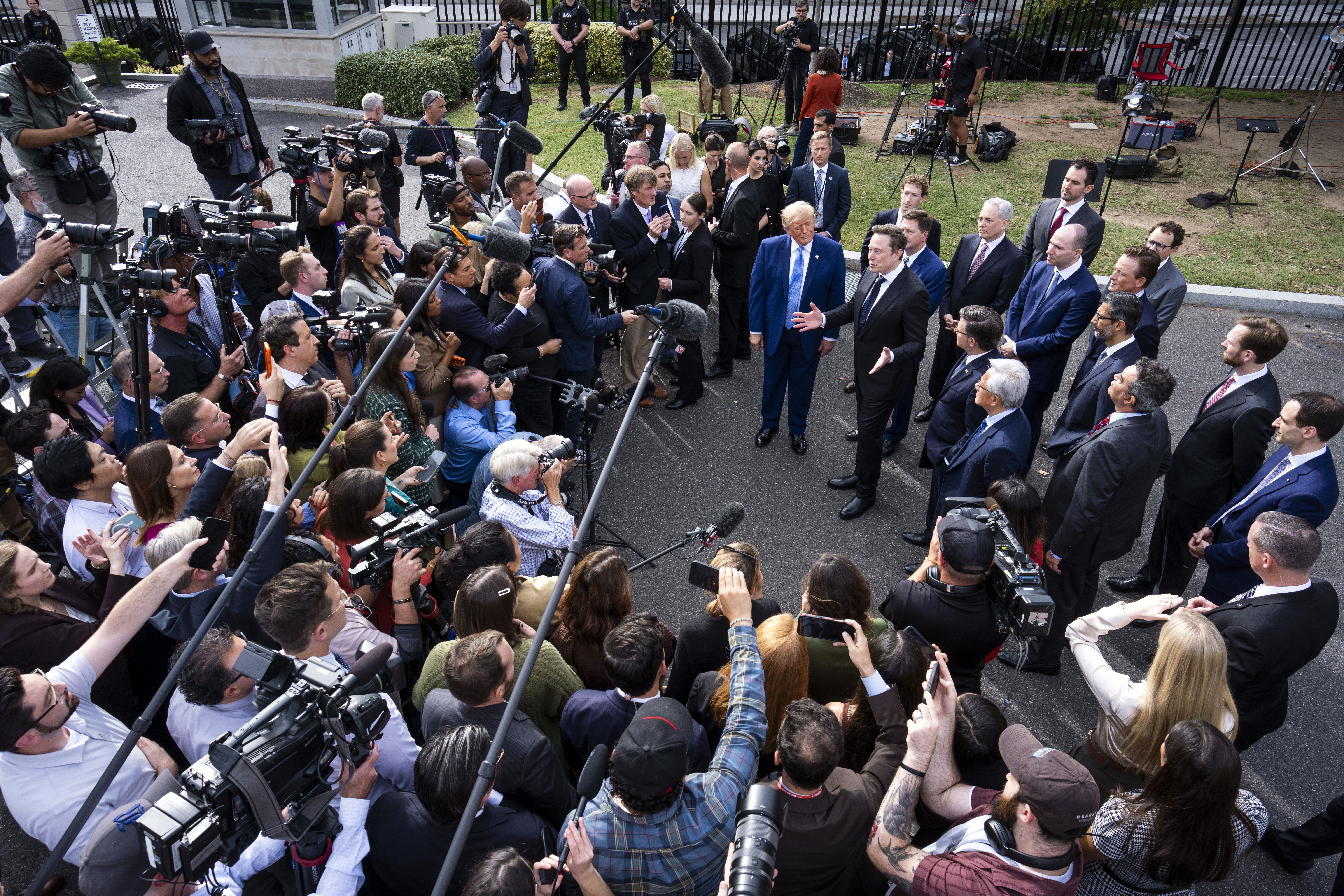 Elon Musk and President Trump speak to reporters at the White House last month.
