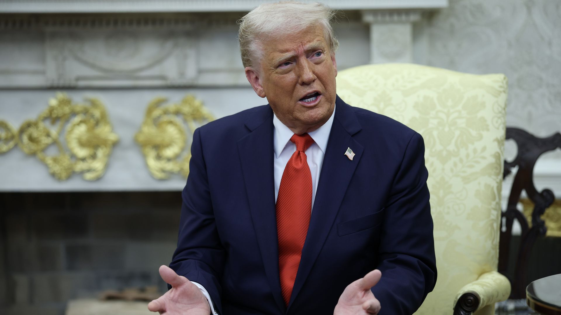 Trump holds up hands