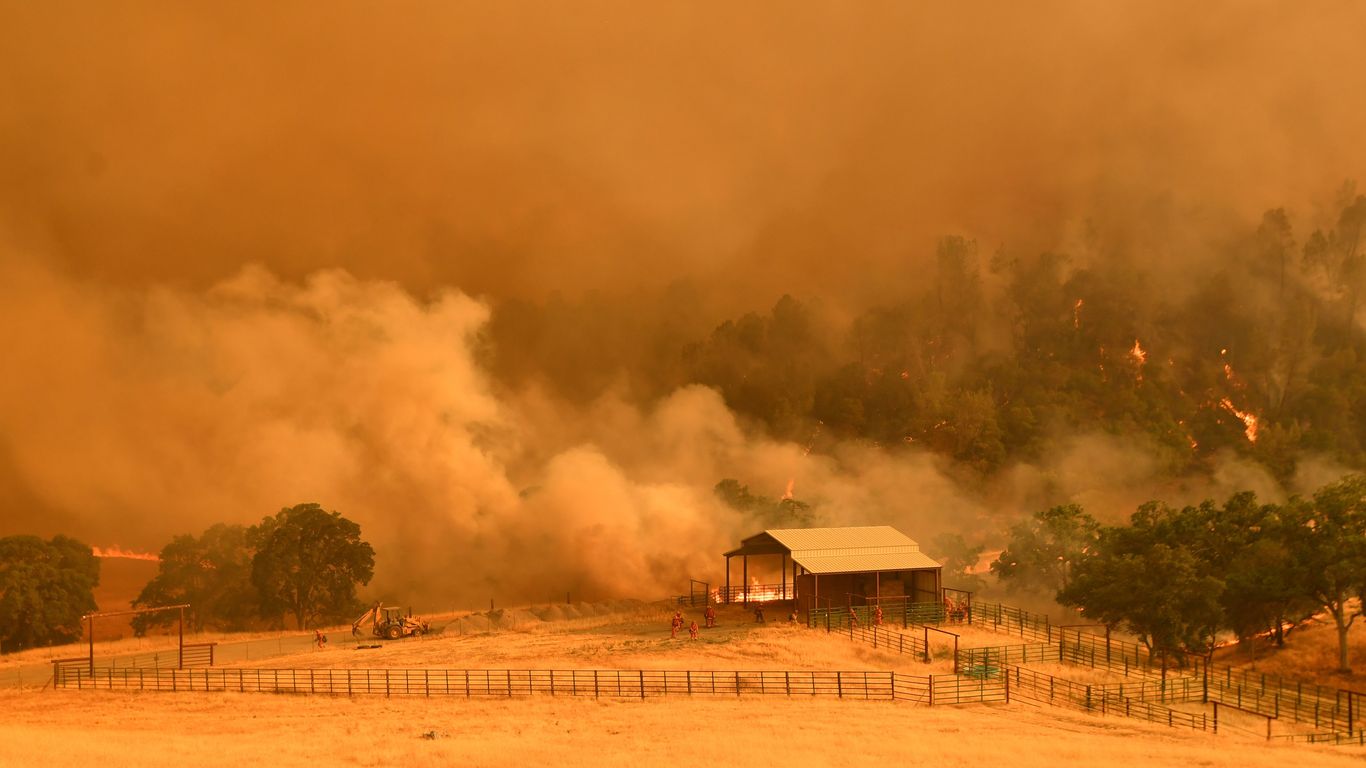 Fires rage in California amid record heat, thousands without power