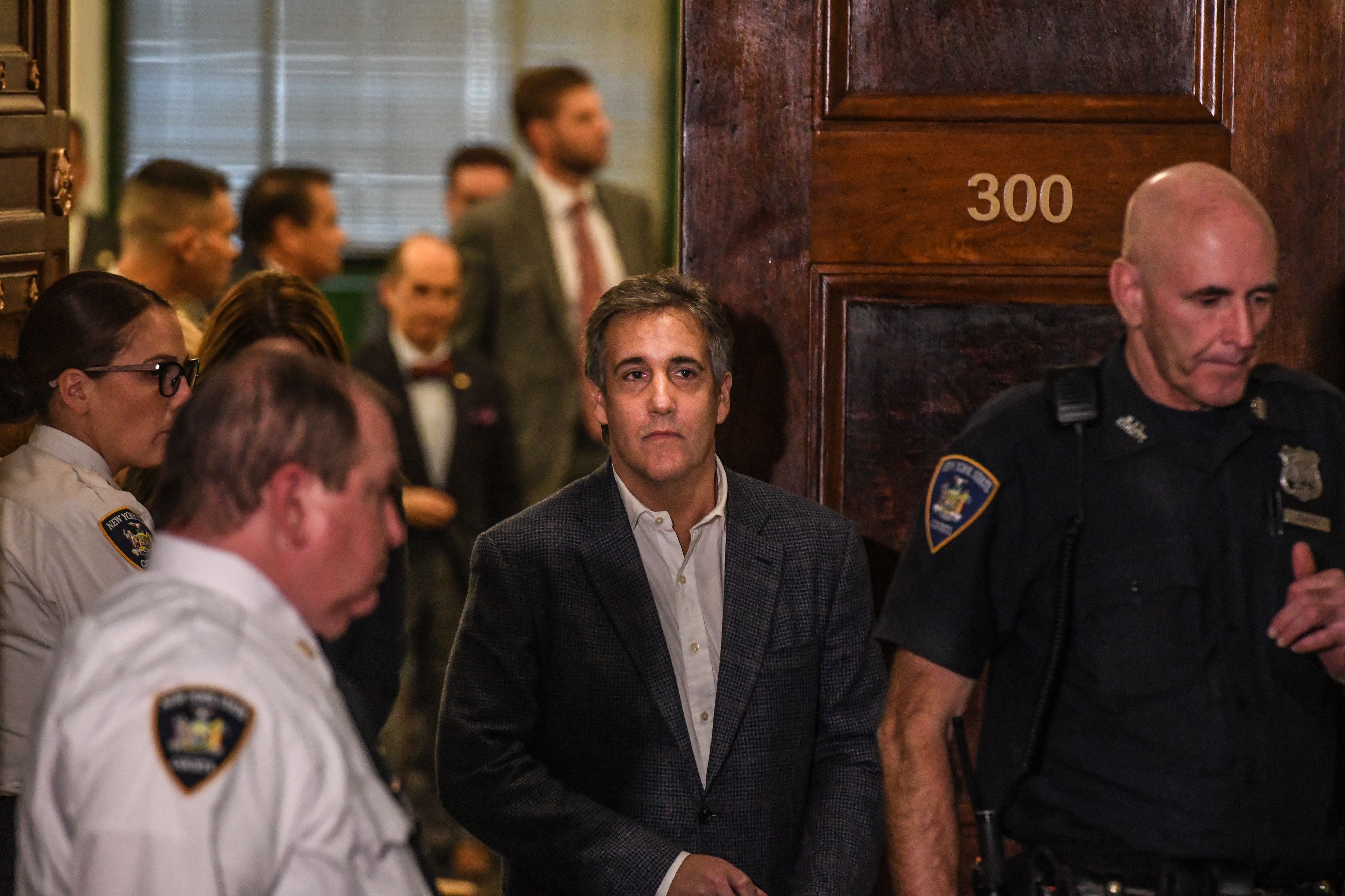 Michael Cohen walks into a New York courtroom in 2023.