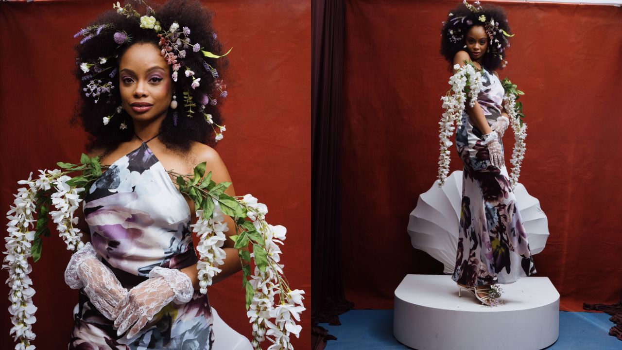 Two-panel image of a woman with a voluminous Afro wearing a floral one-shoulder dress, flower crown, lace gloves, and long white garlands, set against a red backdrop; she stands on a white pedestal.