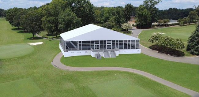 The Nest. A rendering of a white building on a golf course surrounded by trees and fairways.