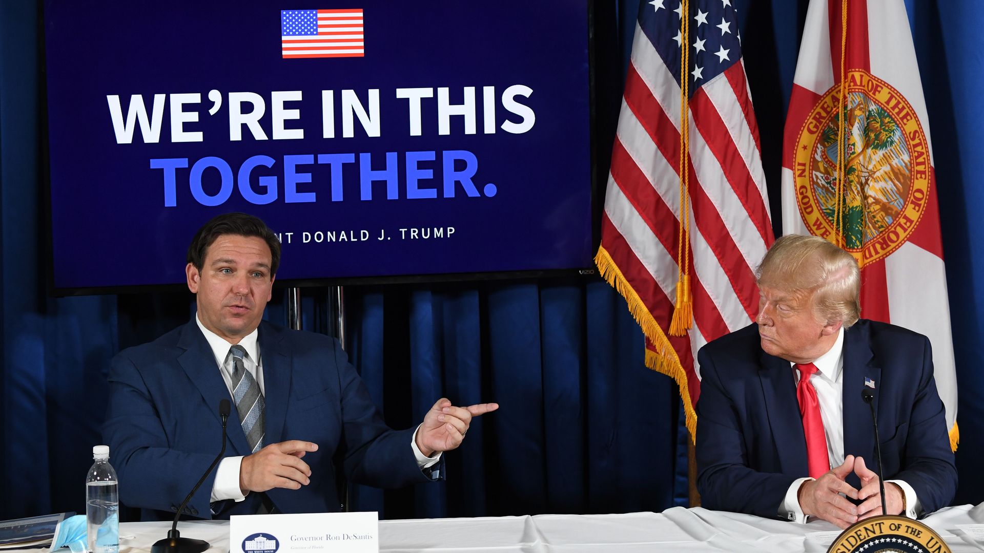  President Donald Trump (R) and Florida's governor Ron DeSantis hold a COVID-19 and storm preparedness roundtable in Belleair, Florida, July 31, 2020.
