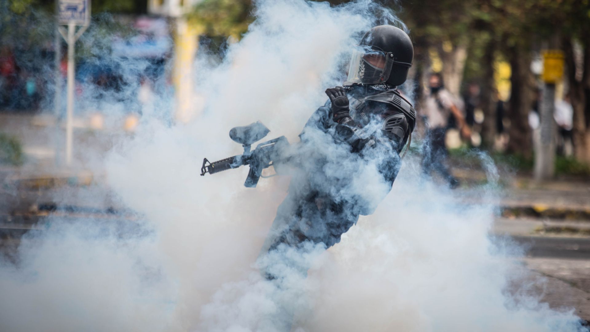 Riot police confront demonstrators during clashes in Quito.