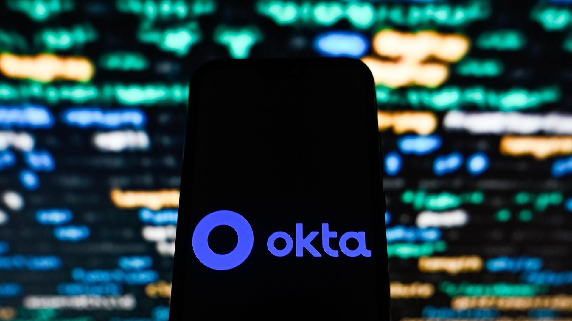 Image of a phone with the Okta logo on it