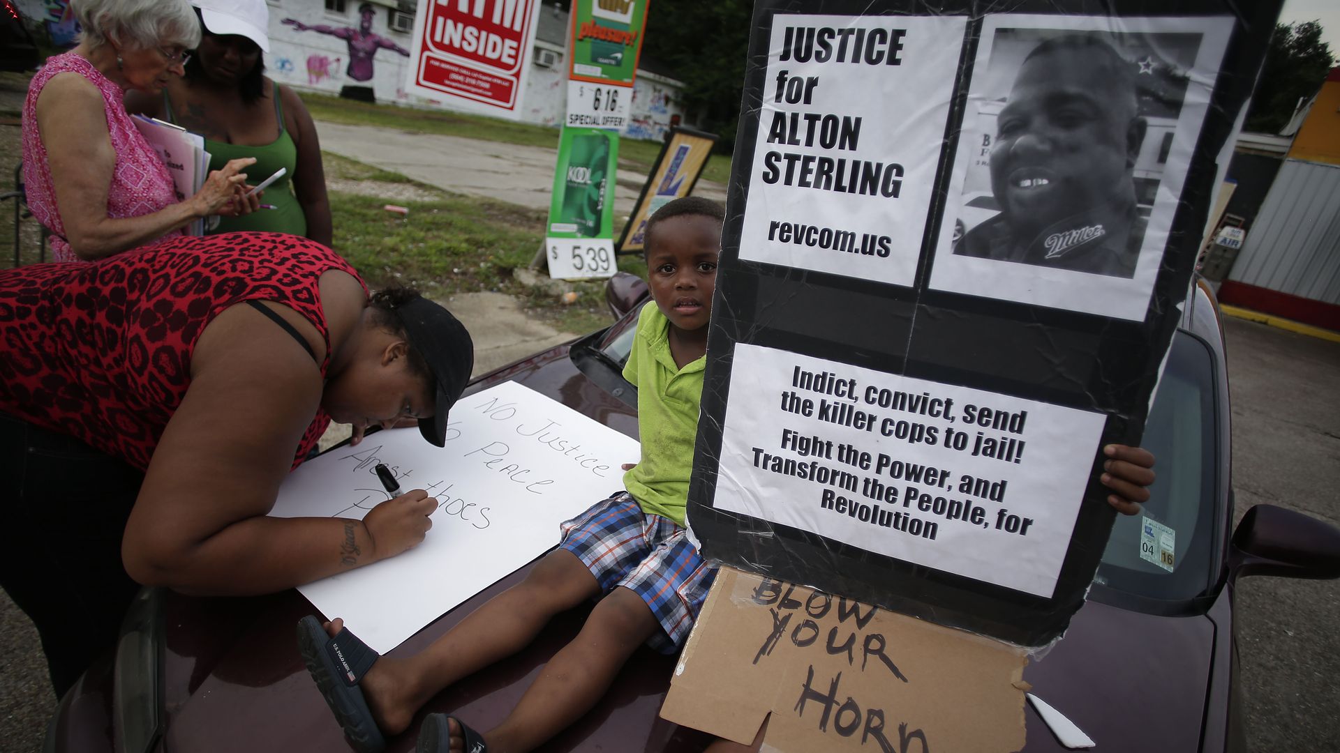 Demonstrators protest the fatal police shooting of Alton Sterling July 21, 2016.