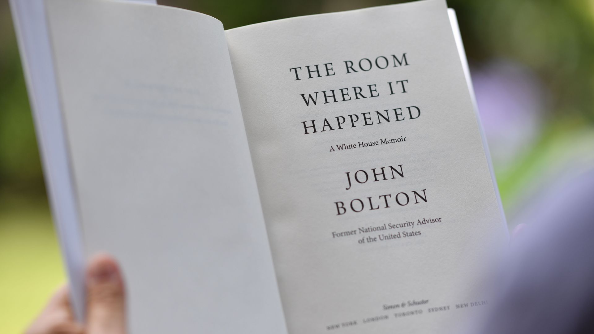 The inside cover of a book that reads "The room where it happened" 