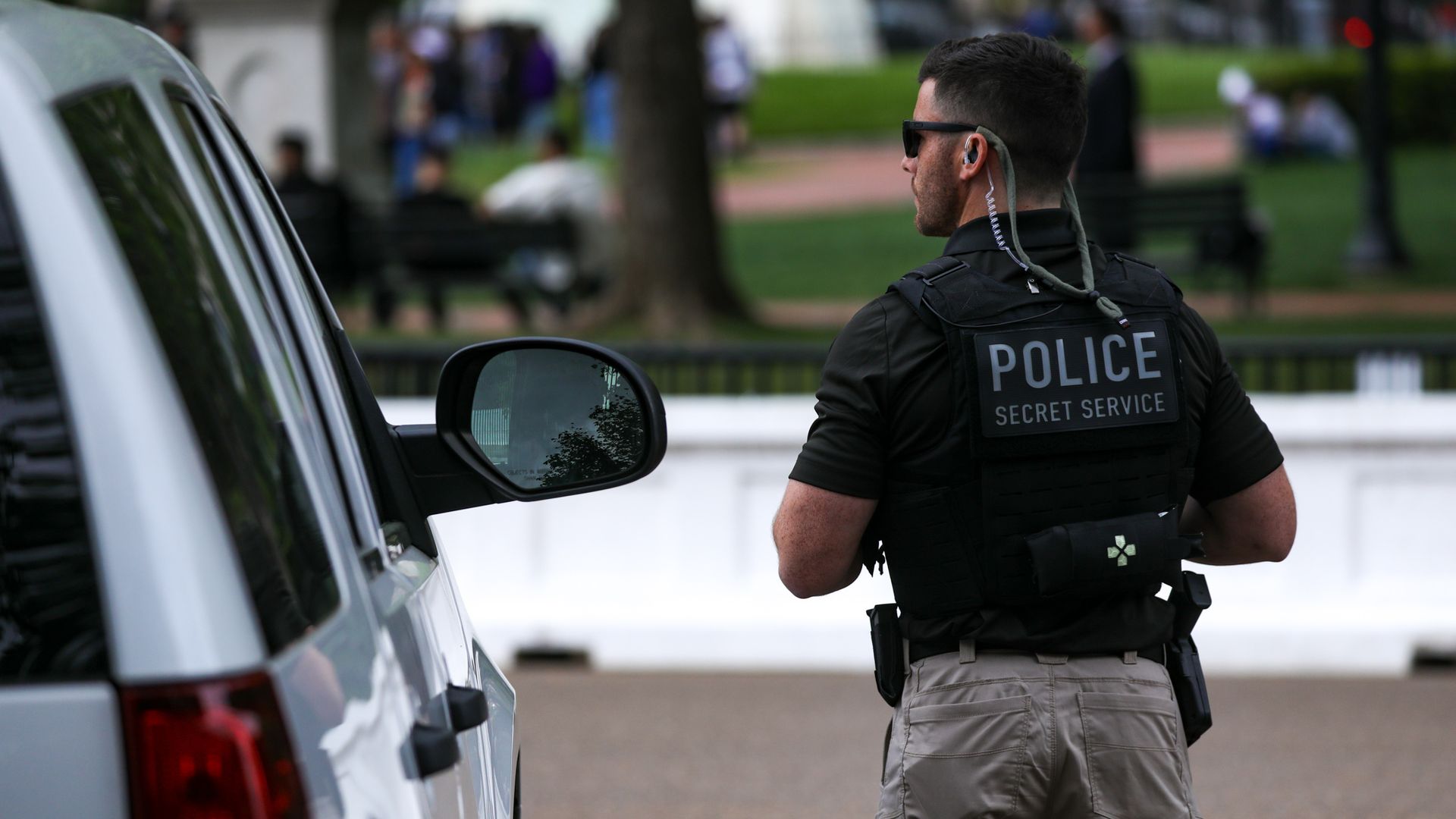 A Secret Service agent is seen on Pennsylvania Avenue in front of the White House.