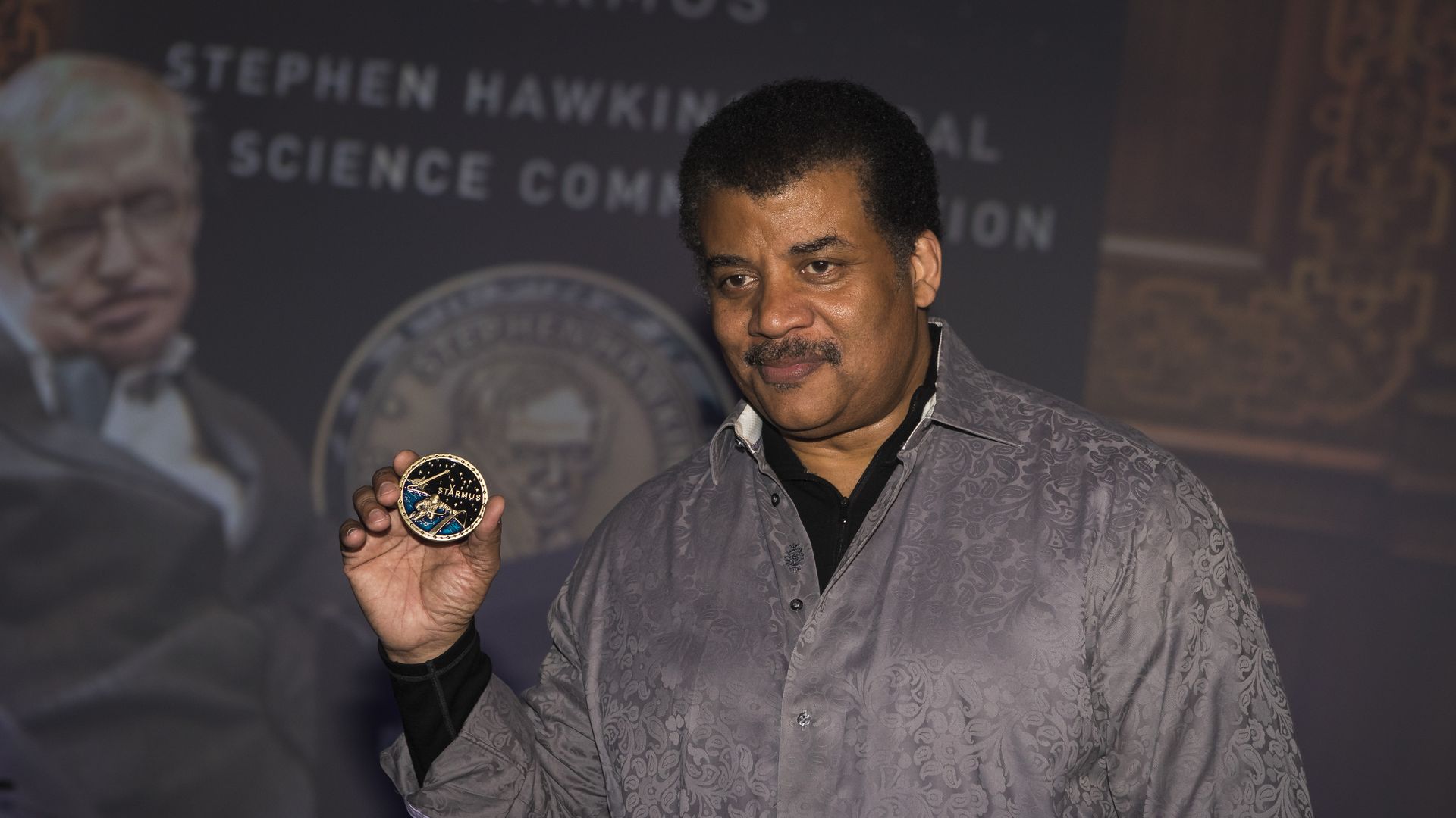 Neil deGrasse Tyson with the Stephen Hawking Medal for Science Communication. 