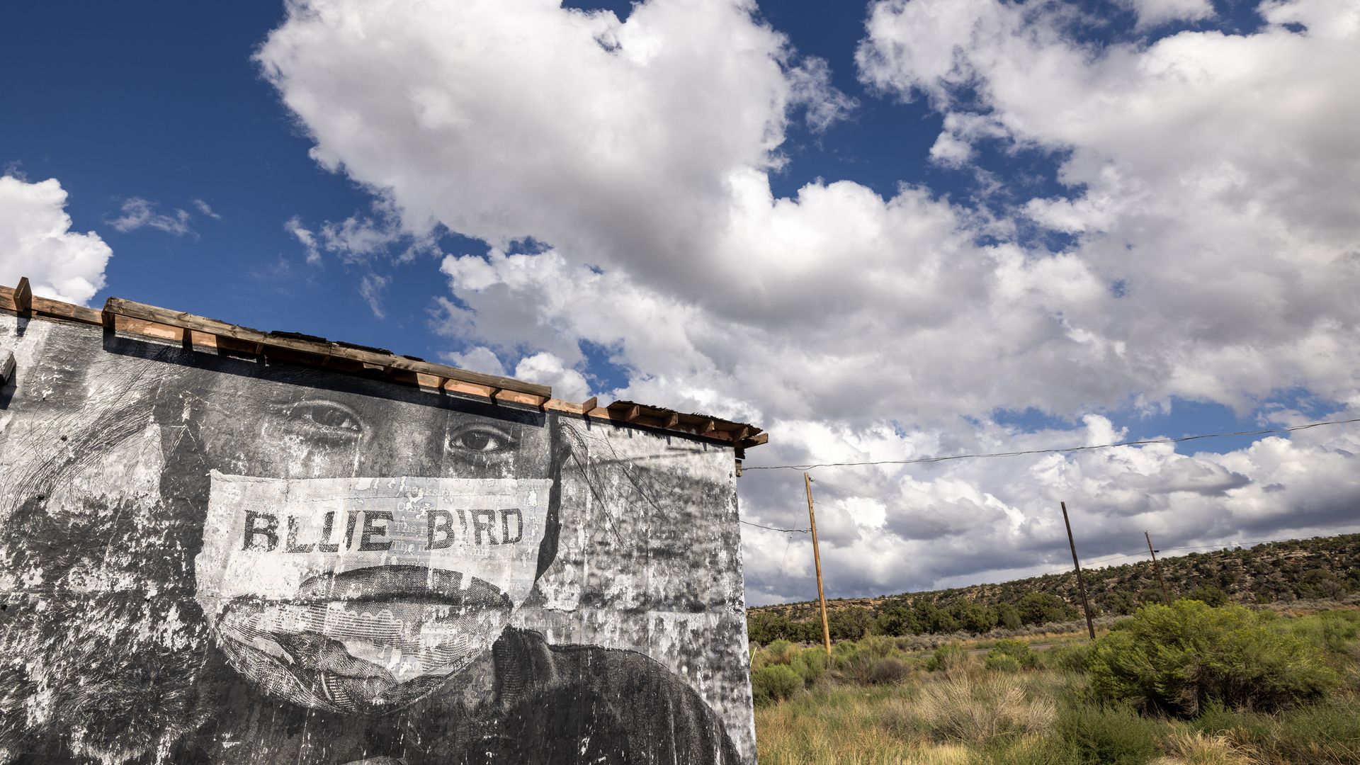  Navajo Nation mural of a person wearing a mask made from a Blue Bird flour sack sits near Kayenta, Arizona on the Navajo Nation on August 23, 2024.