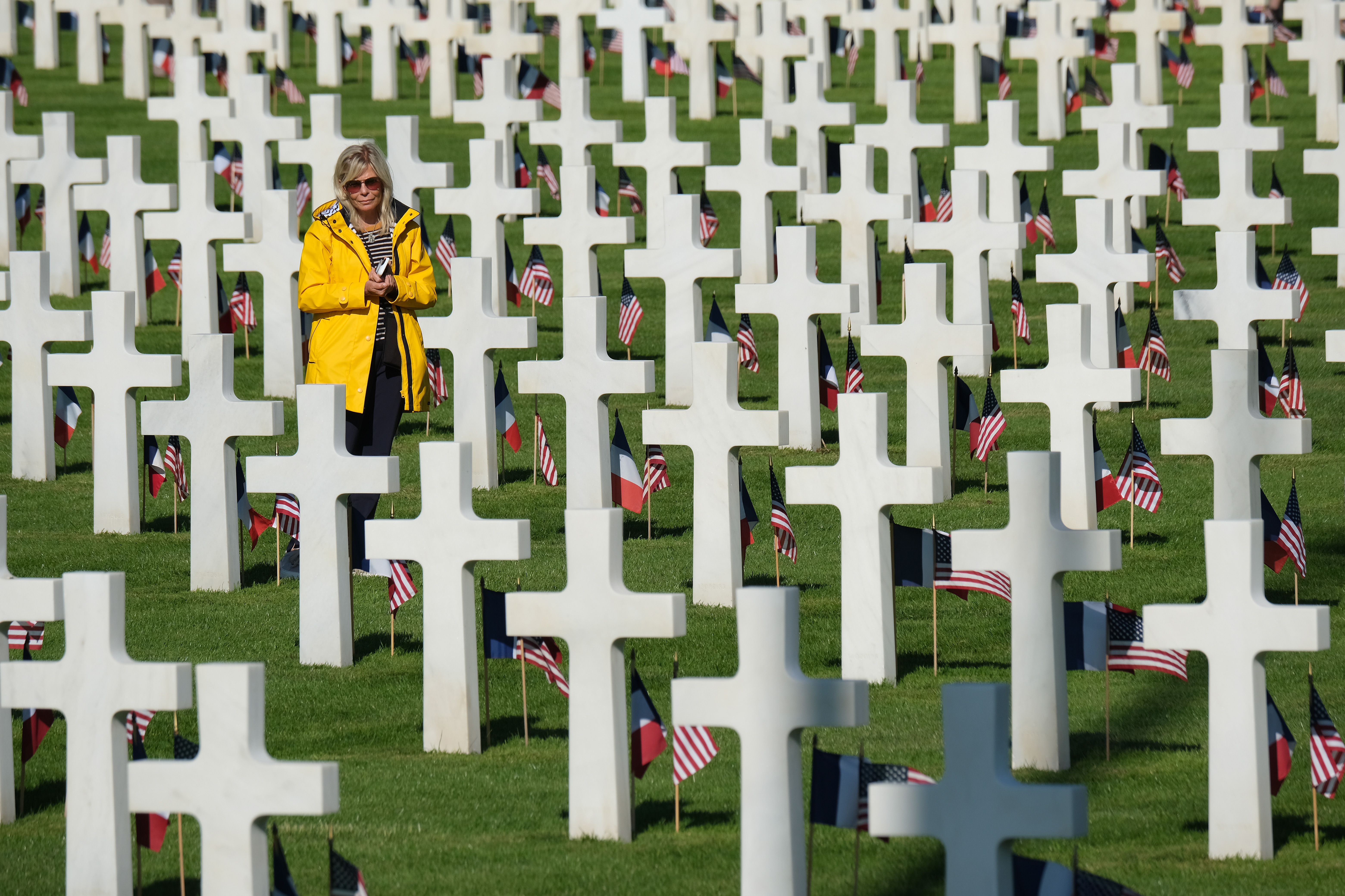 A visitor walks among graves at the Normandy American Cemetery on the 75th anniversary of the World War II Allied D-Day invasion on June 06, 2019 near Colleville-Sur-Mer, France. 