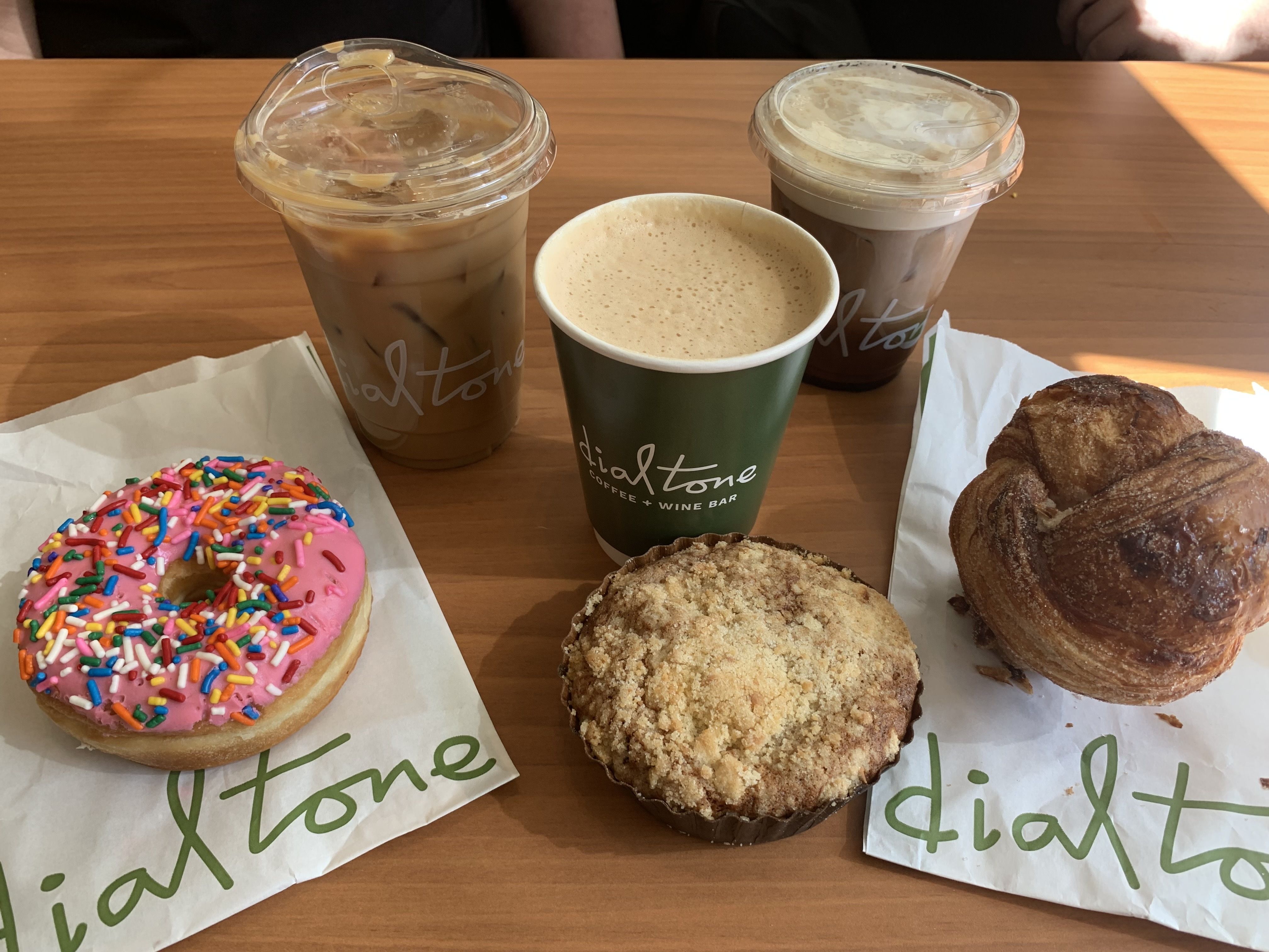 Photo of coffee and pastries on a table. 