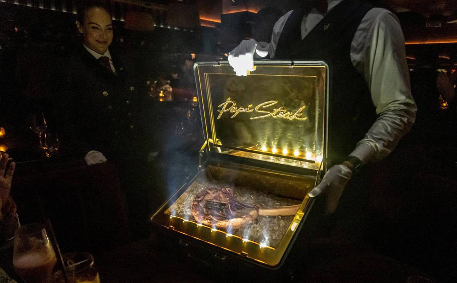 The restaurant Papi Steak in Miami Beach serves a $1,000 Wagyu tomahawk steak that is presented to the table in a briefcase. A branded steak is revealed at the table before being taken to the kitchen for preparation. (Jose A. Iglesias/Miami Herald/Tribune News Service via Getty Images)
