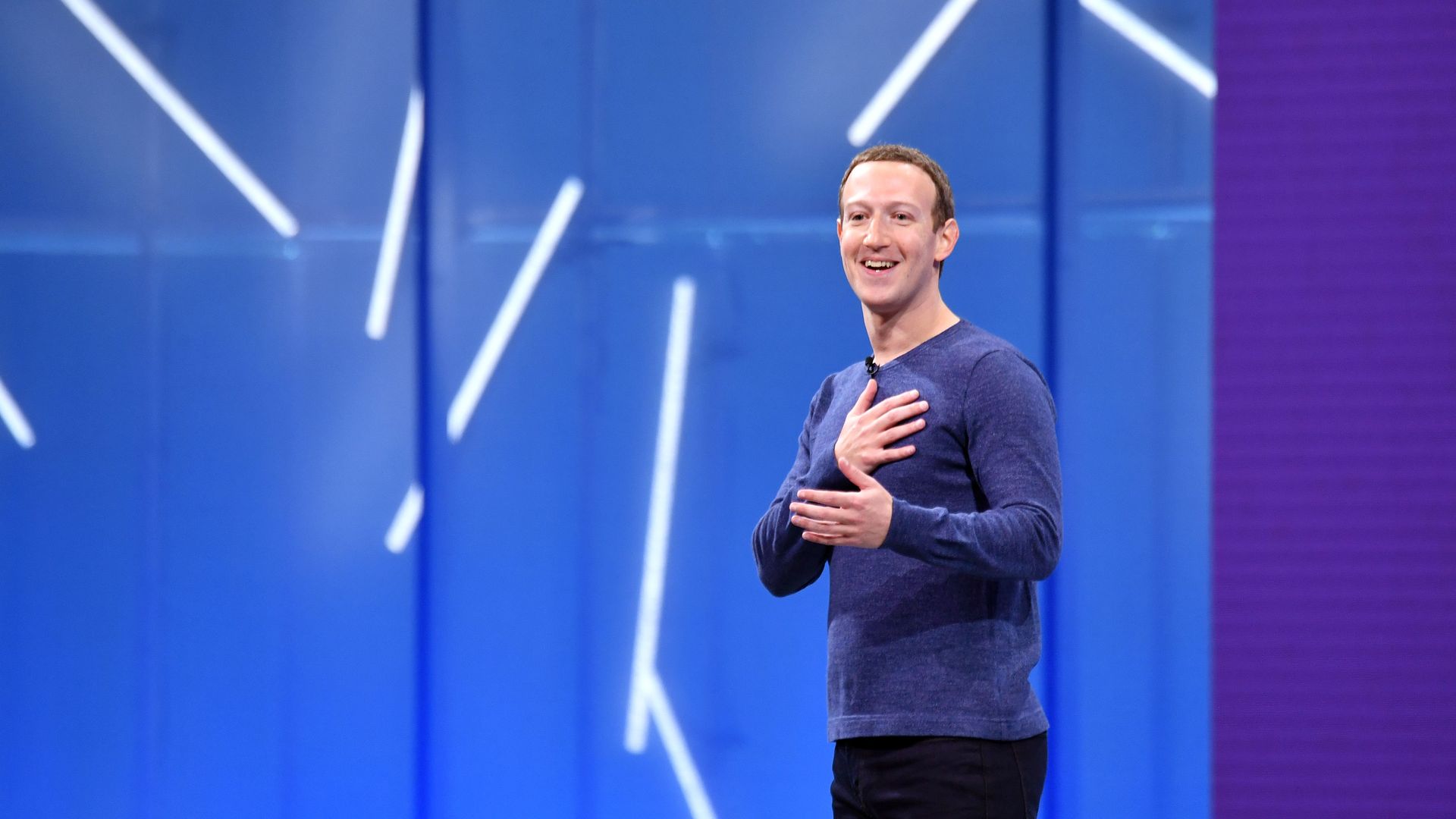 Mark Zuckerberg's Facebook smiling at a developer conference.