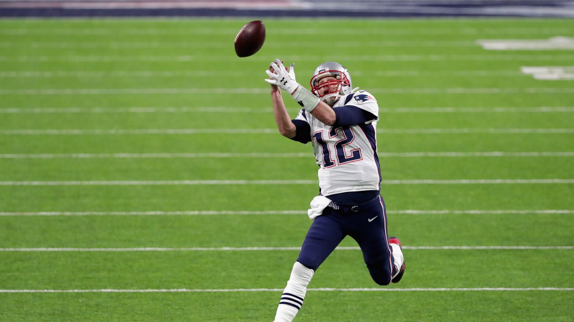 tom brady trying to catch a pass