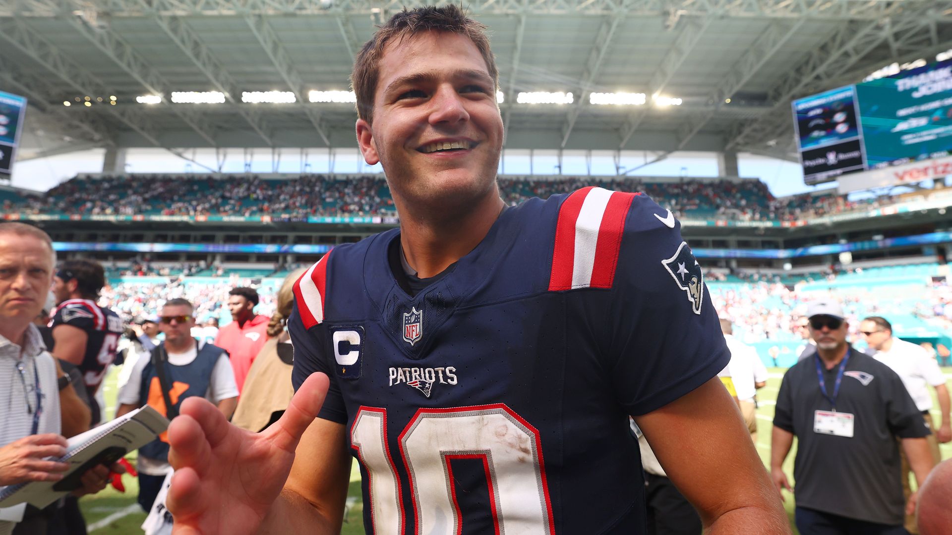 Drake Maye #10 of the New England Patriots celebrates the team's 33-27 win against the Miami Dolphins in the game at Hard Rock Stadium on September 14, 2025 in Miami Gardens, Florida. (Photo by Carmen Mandato/Getty Images)