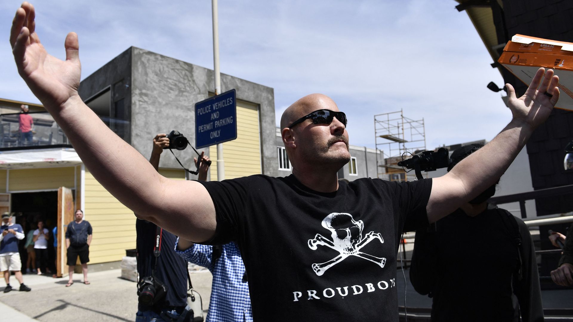 A person wears a Proud Boys t-shirt as demonstrators face off during a demonstration for a "White Lives Matter" march and rally on April 11, 2021 in Huntington Beach, California. 