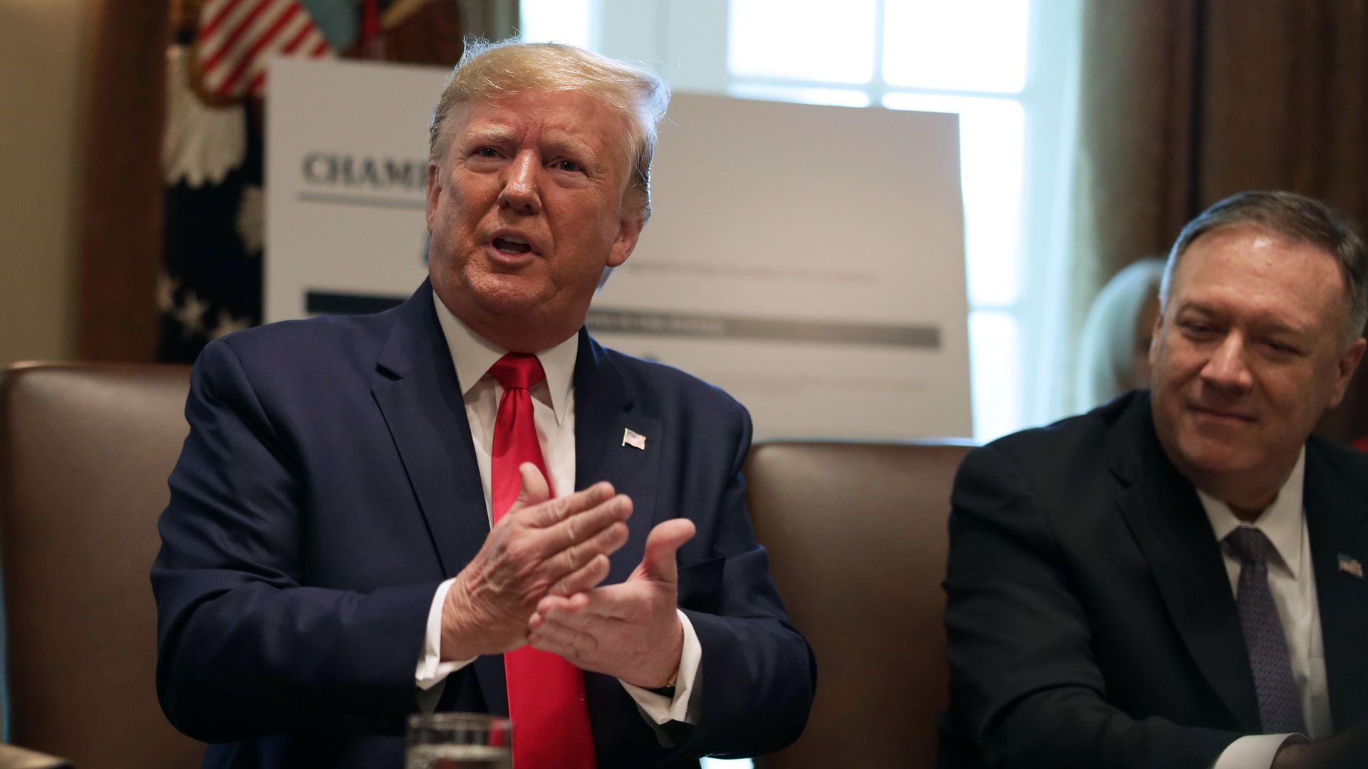 President Donald Trump speaks as Secretary of Health and Human Services Alex Azar and Secretary of State Mike Pompeo listen during a cabinet meeting at the Cabinet Room of the White House October 2