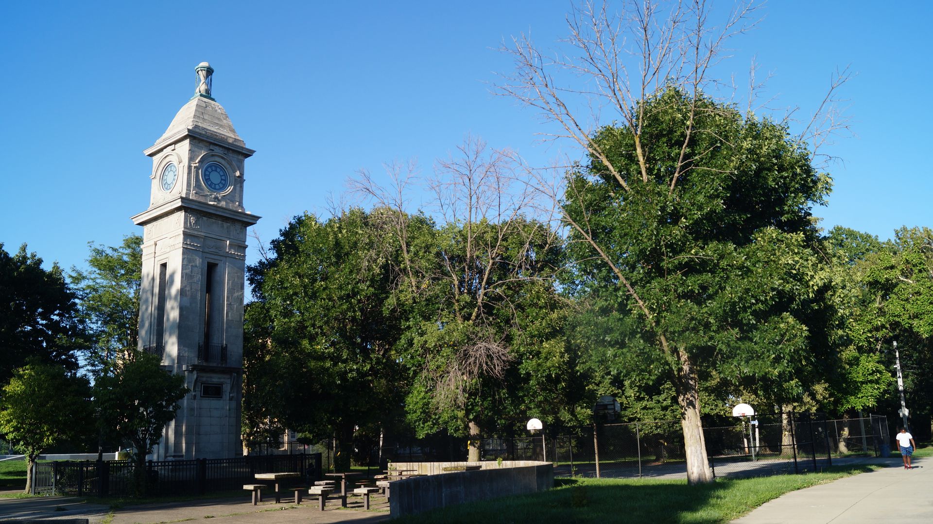 A public park with a watchtower on the left 