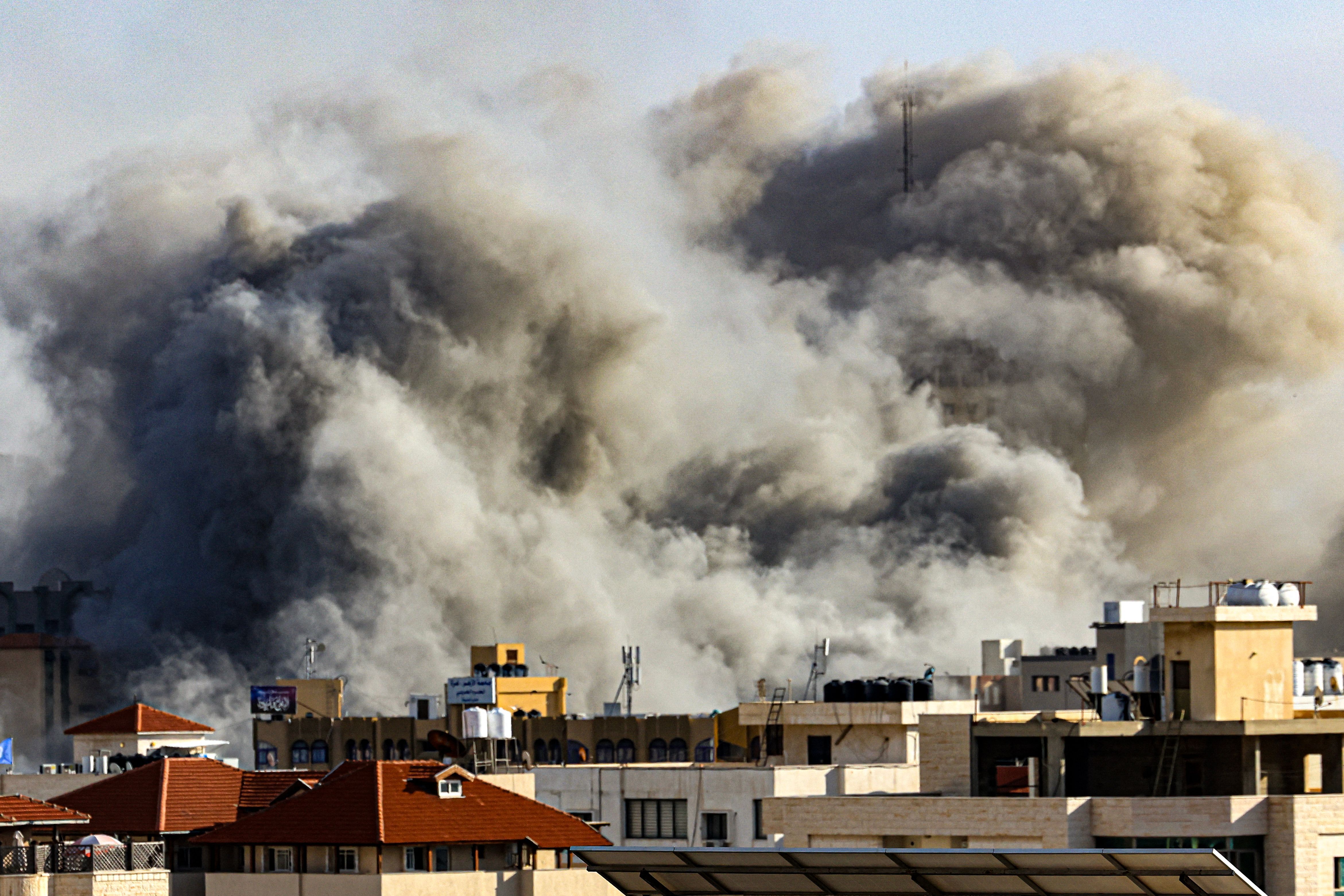 Smoke plumes rise over Gaza City on October 7, 2023 during Israeli air strikes.