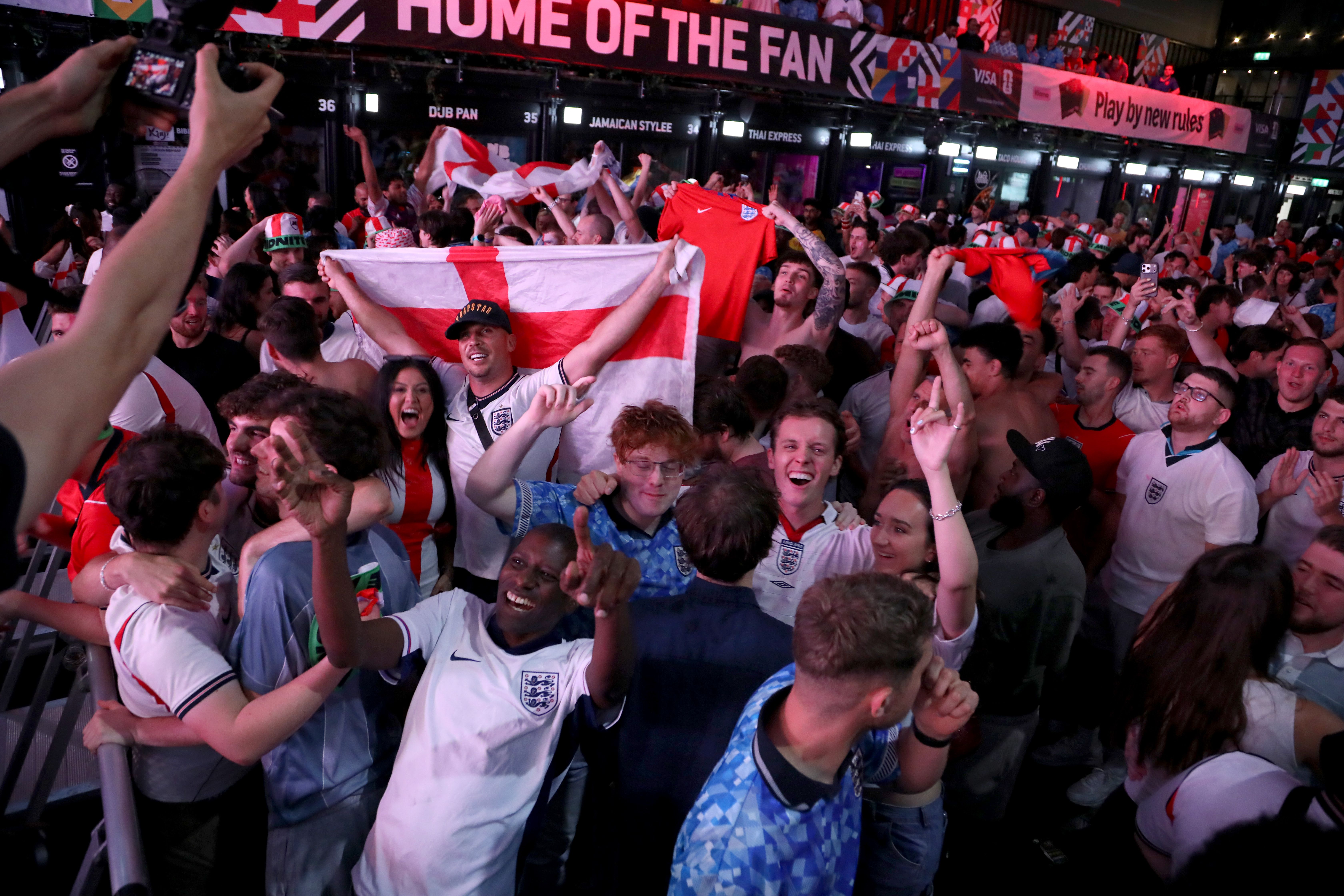 England fans cheer during a watch party at Boxpark Croydon for the FIFA World Cup 2026 Round of 16 match between Mexico and England on July 6, 2026 in London, England. This round 16 knockout match takes place at the iconic Estadio Azteca in Mexico City. Thomas Tuchel's Eng