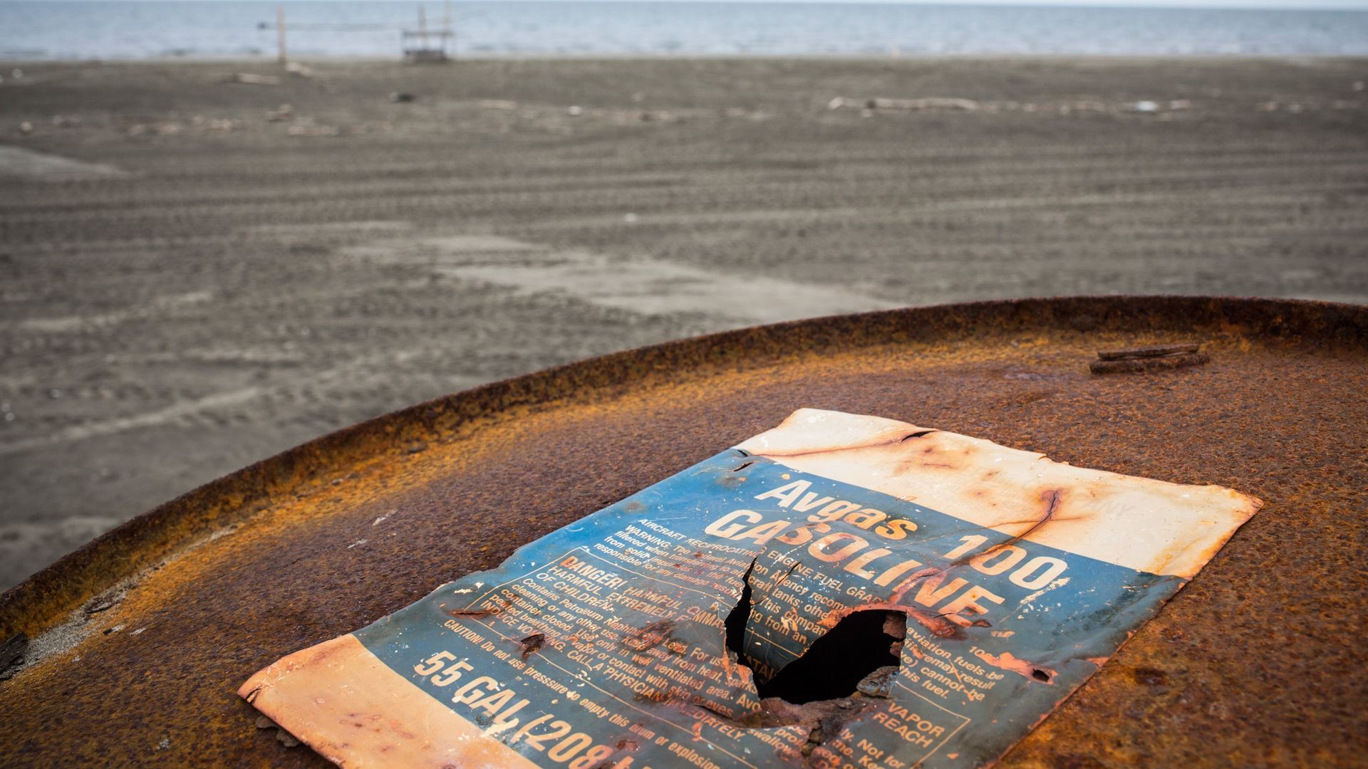 A gas barrel on a beach in Alaska.