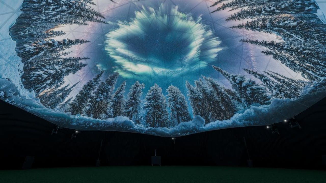 A visual experience in the dome with snow and alpine trees