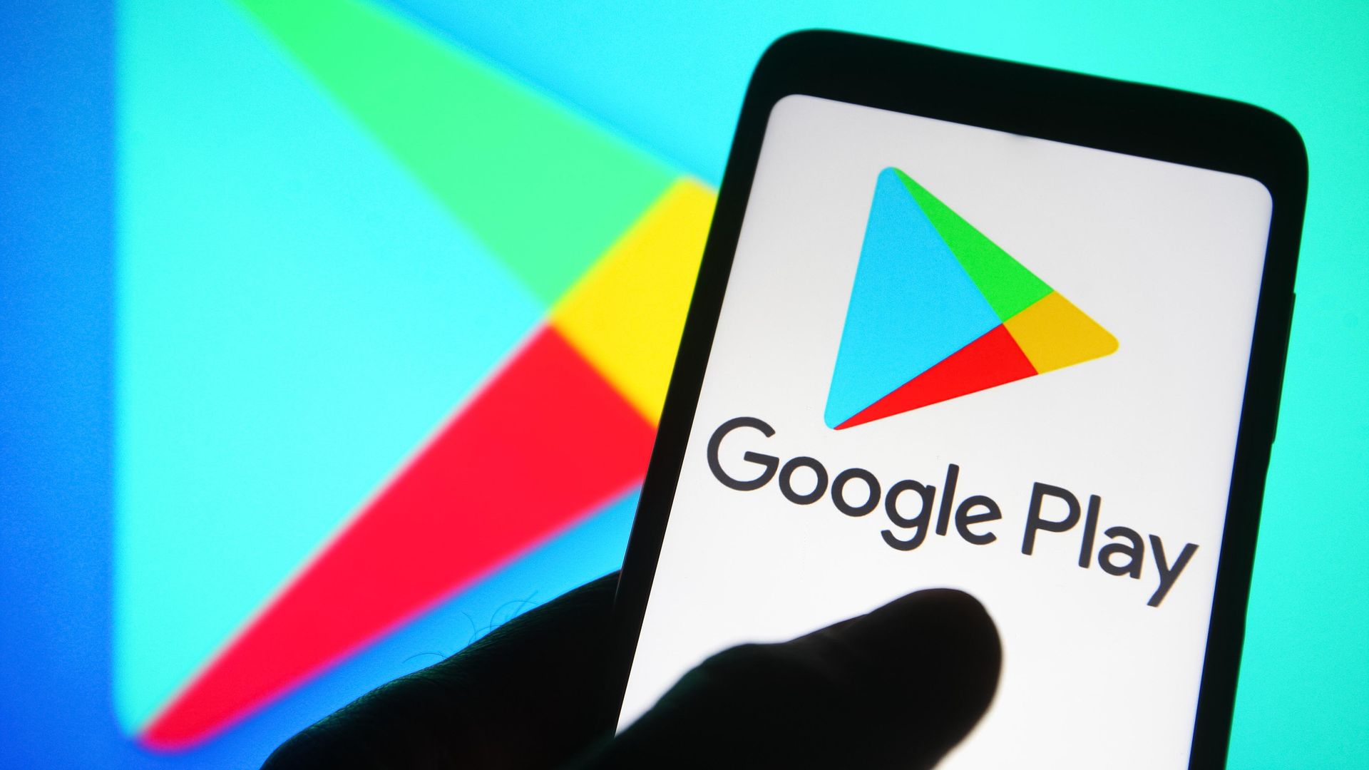 In this photo illustration a Google Play Store logo is seen on a smartphone. 