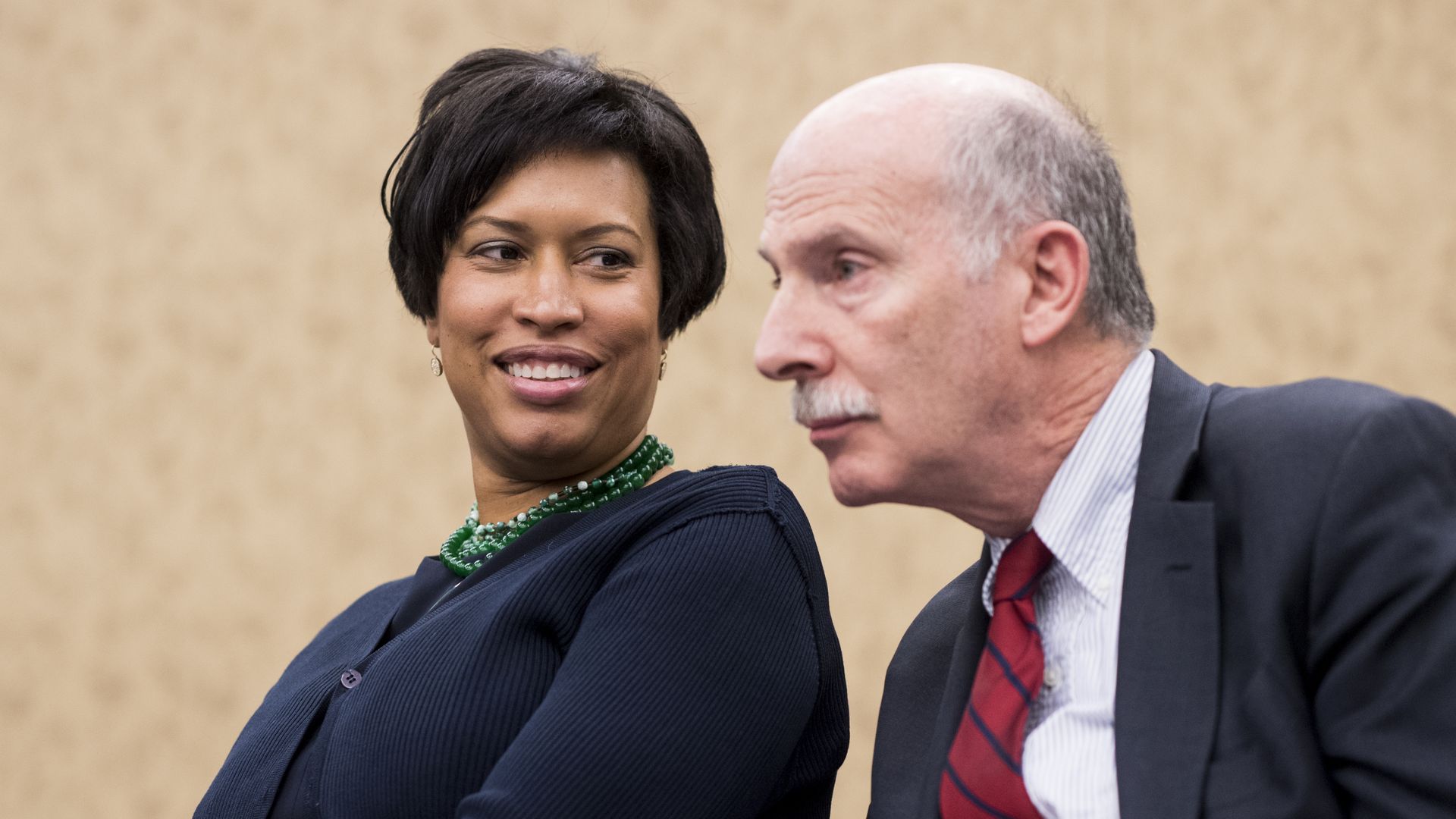 A photograph of Muriel Bowser and Phil Mendelson 