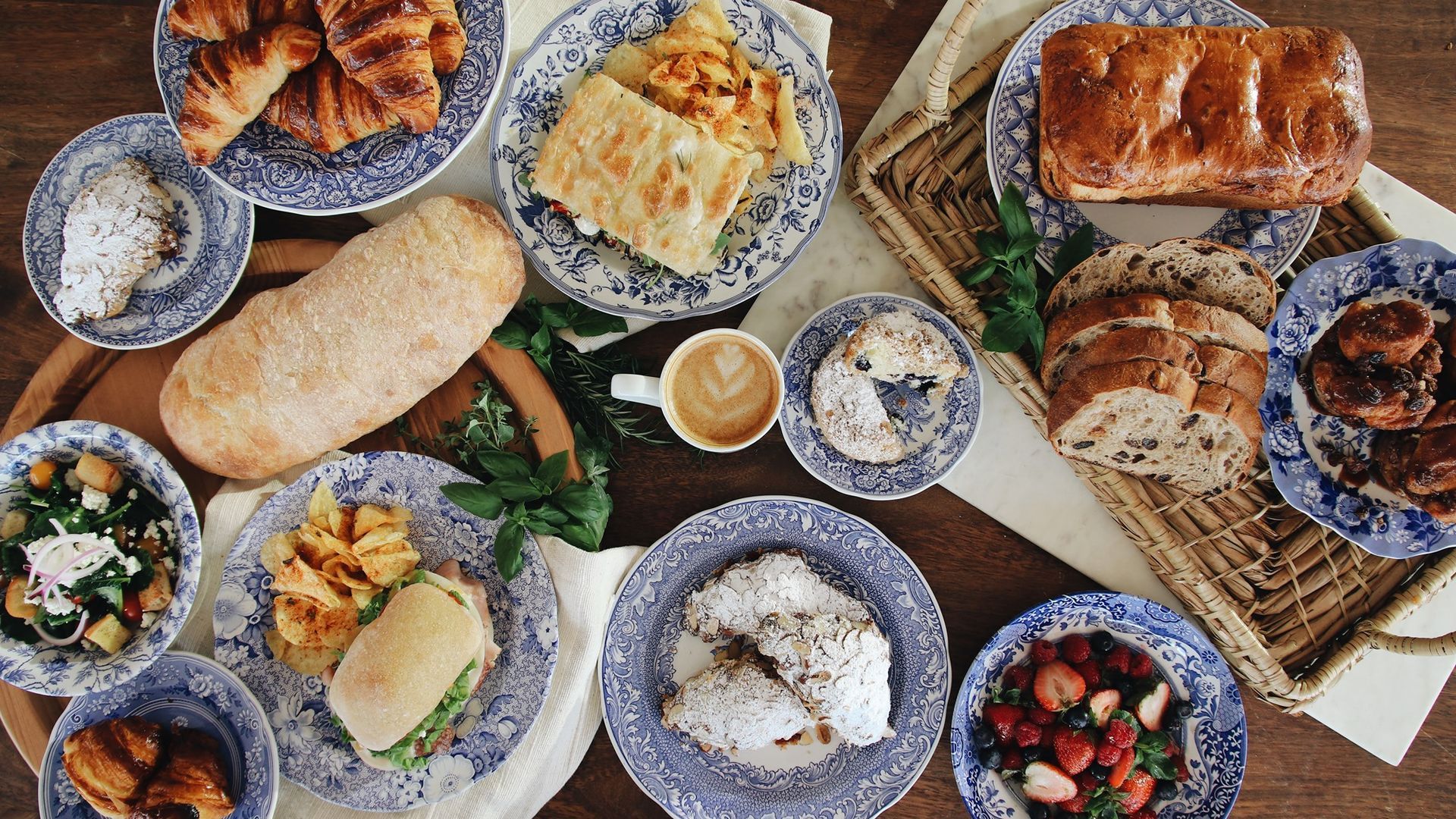 A spread of food, coffee, and baked goods