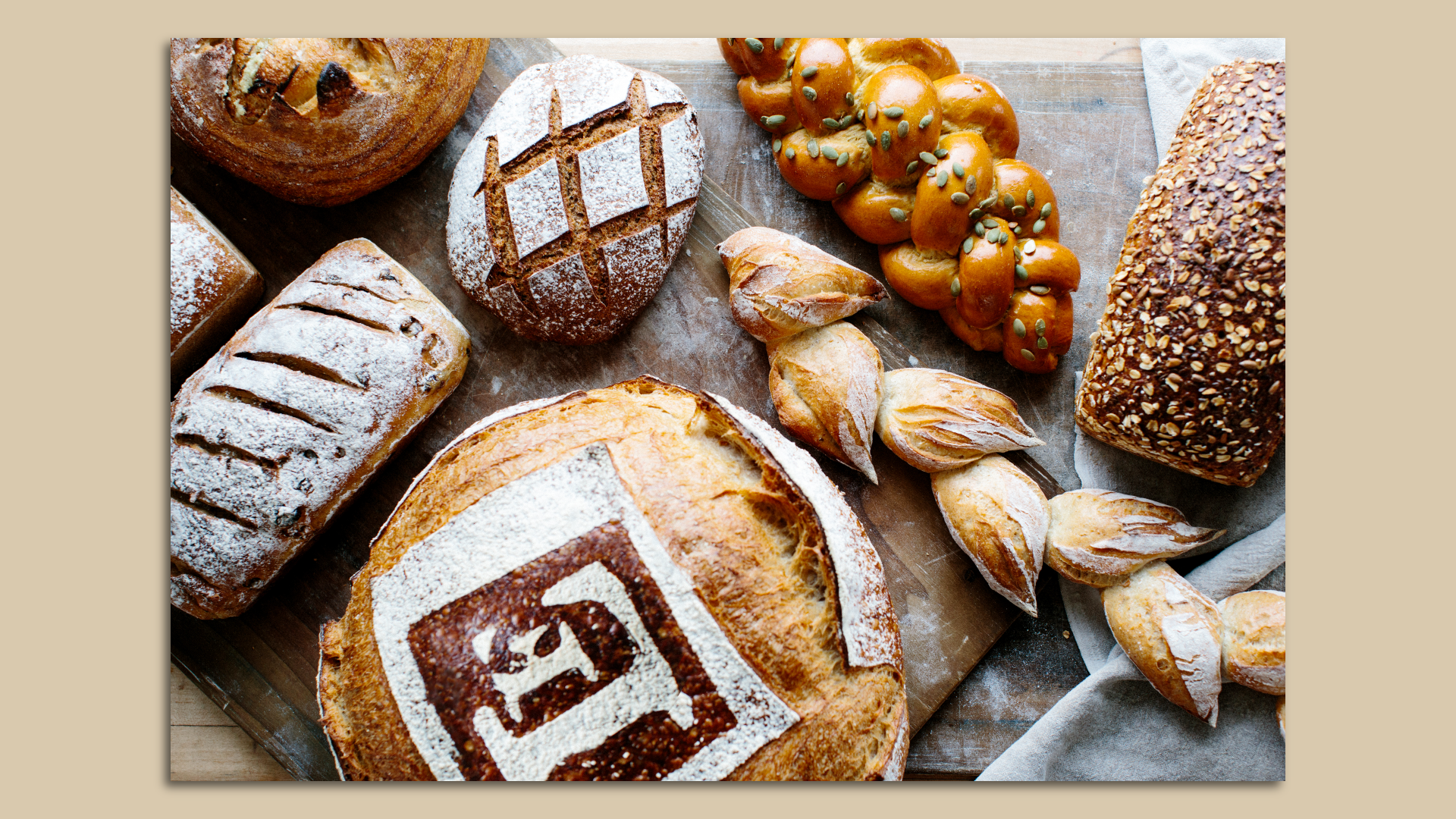 Breads and pastries laid out on a table