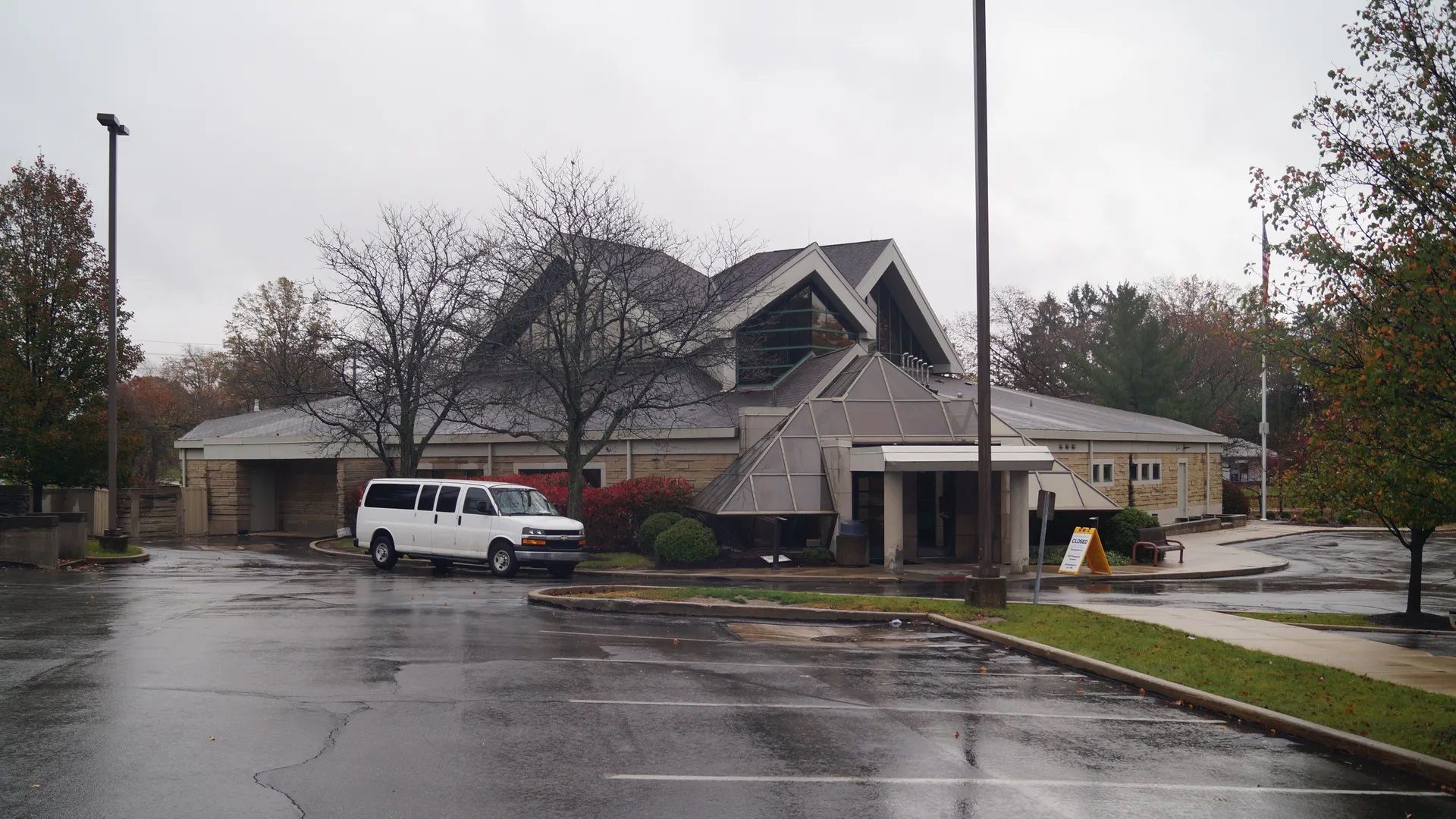The outside of a former library in Brooklyn, Ohio and its parking lot. 
