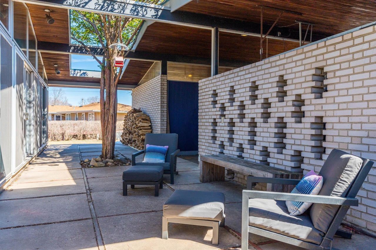 A back deck with brick walls.