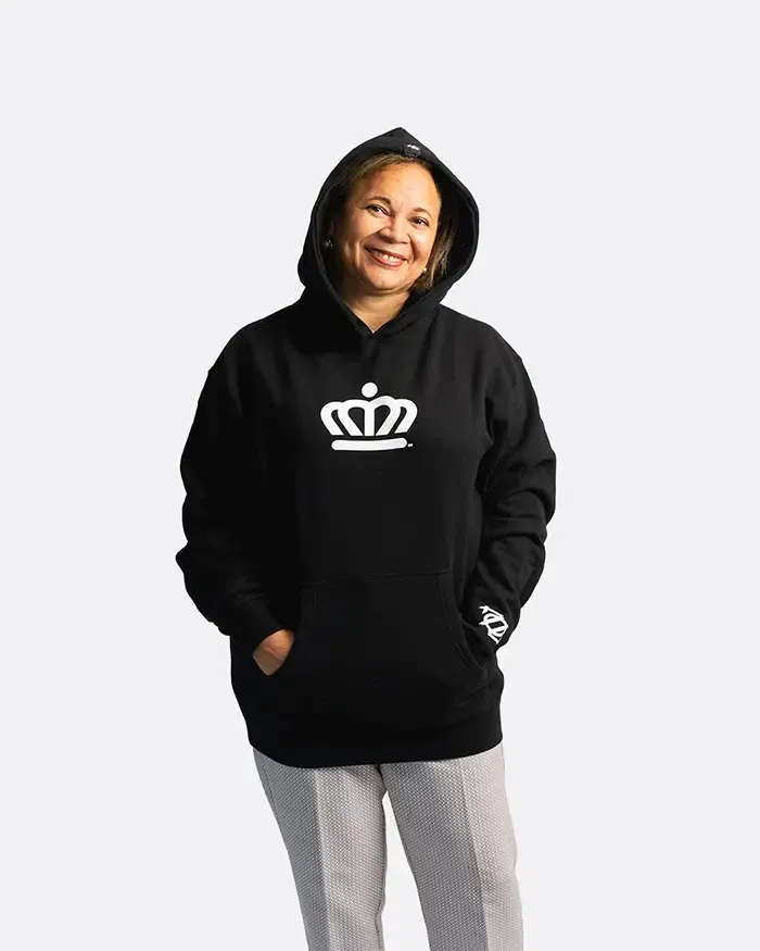Vi Lyles 704 Shop smiling in 704 shop hoodie