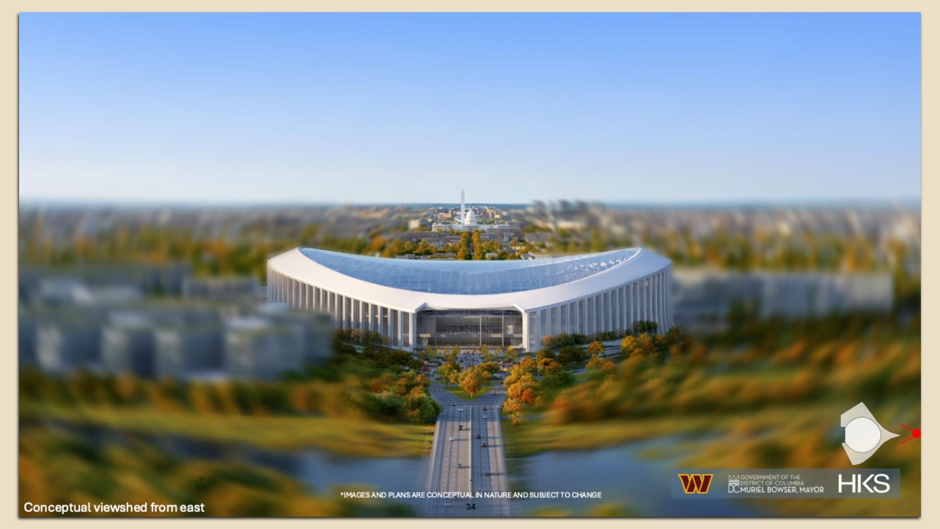 A conceptual 3D model shows a large, modern, U-shaped building with white columns, surrounded by autumn foliage and roads, under a clear blue sky with distant landmarks blurred.