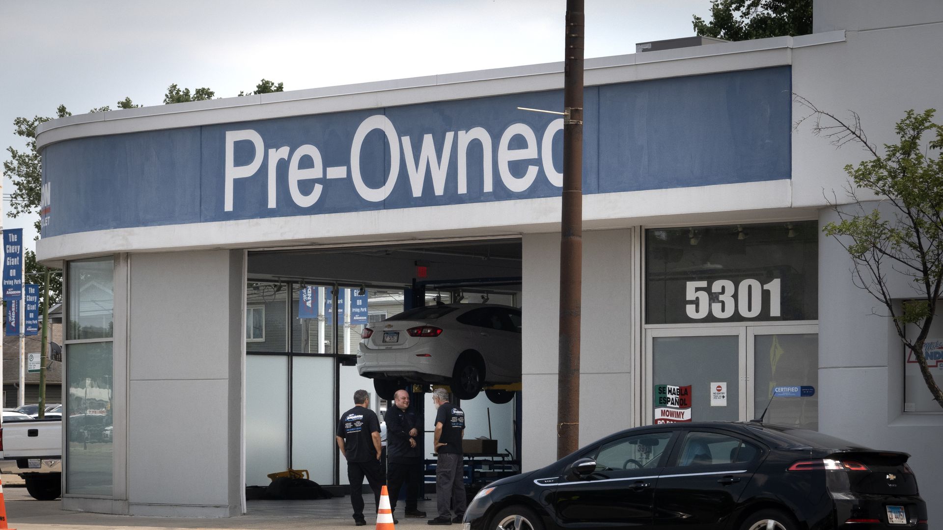 Workers stand in a service bay at Chevrolet dealership on June 20, 2024 in Chicago, Illinois. 