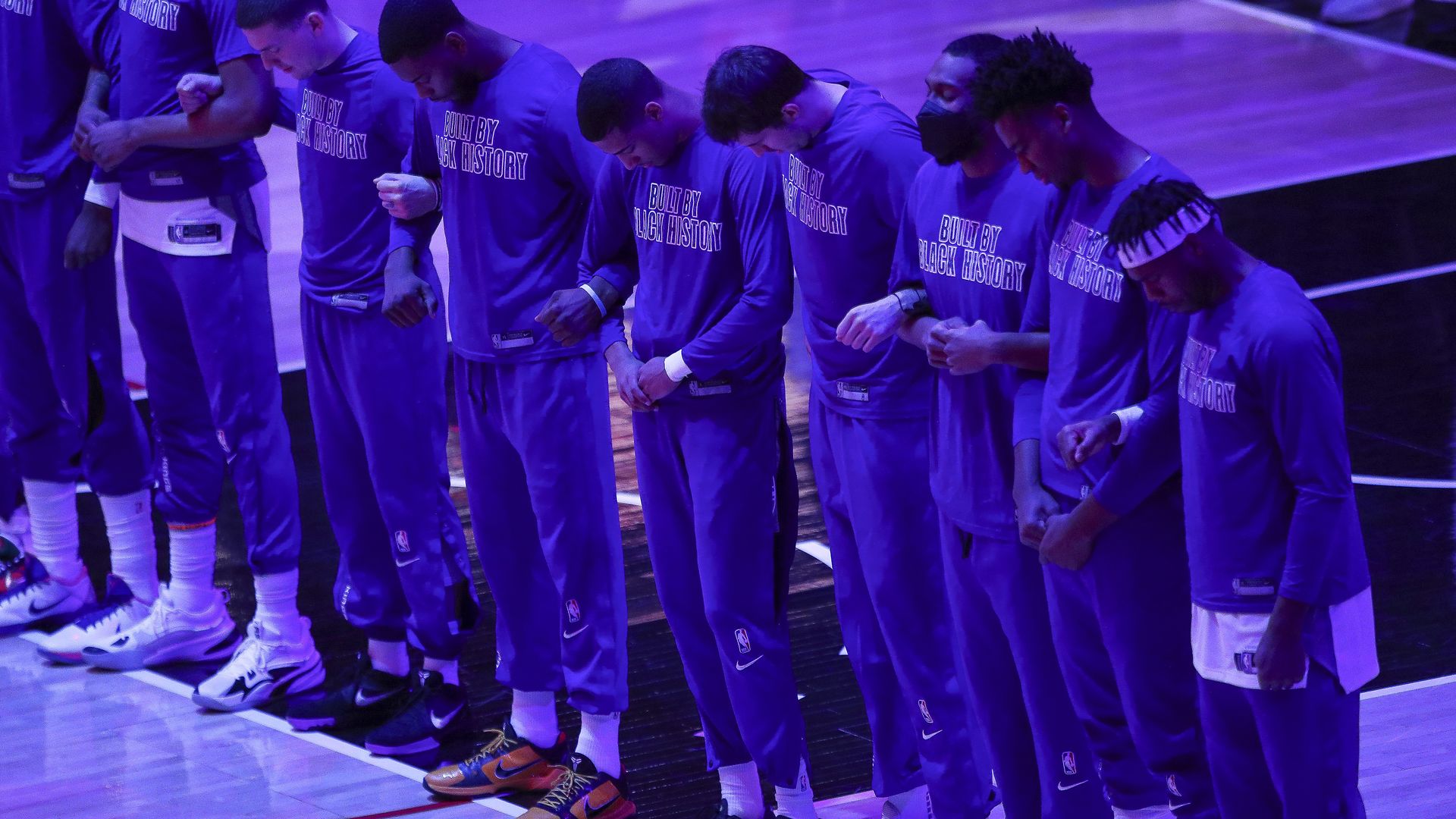 The Sacramento Kings linking arms during the national anthem in Los Angeles on Feb. 7.