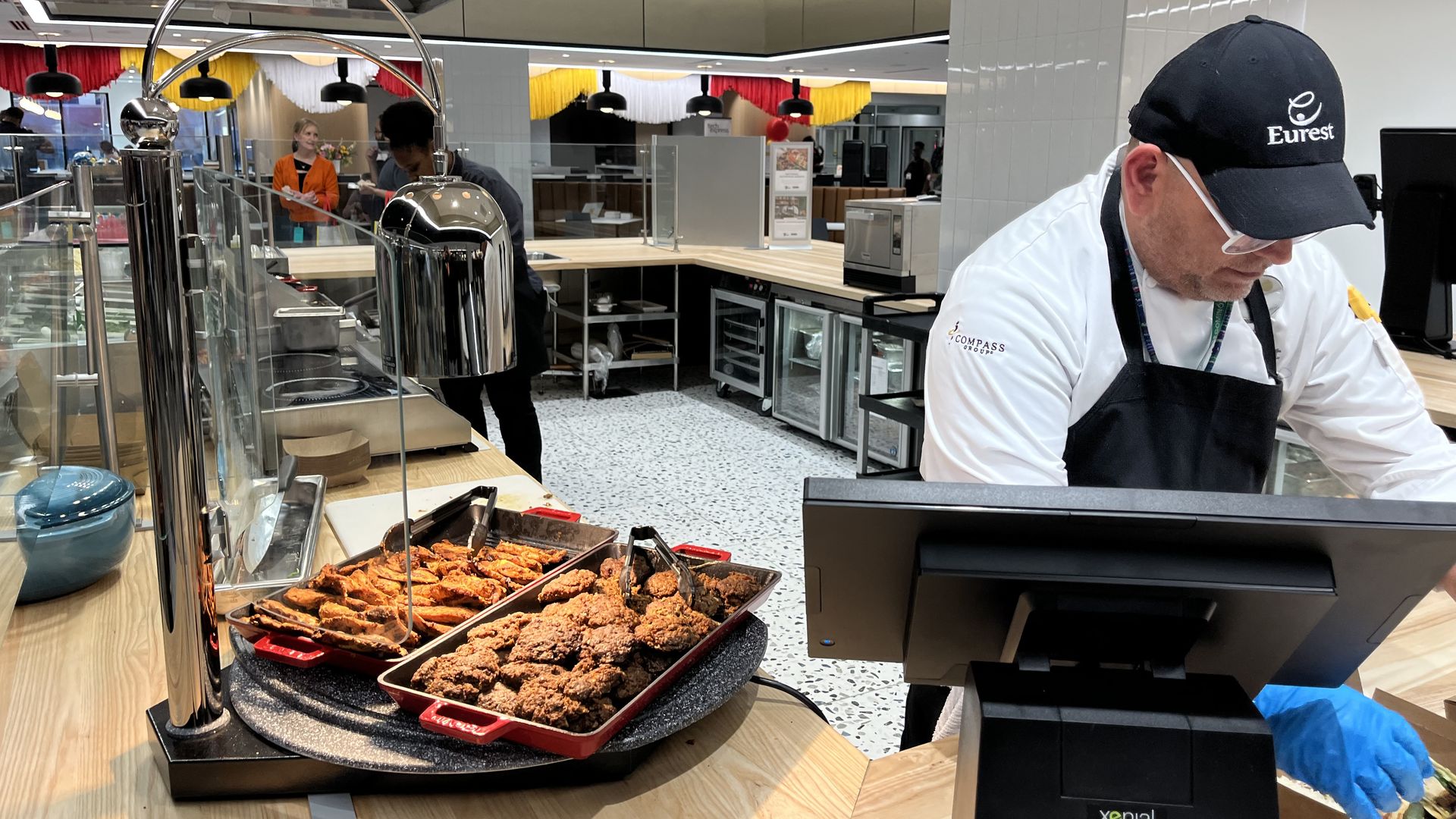 Chef next to a tray of food