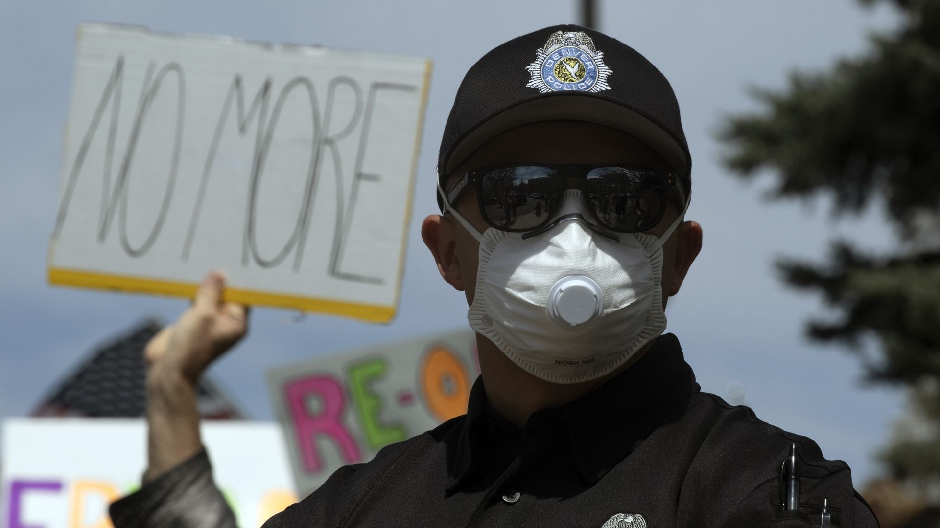 A photo of a Denver police officer wearing a face mask