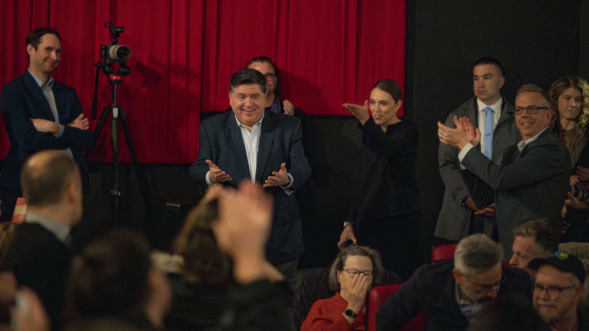 Governor with people clapping for him