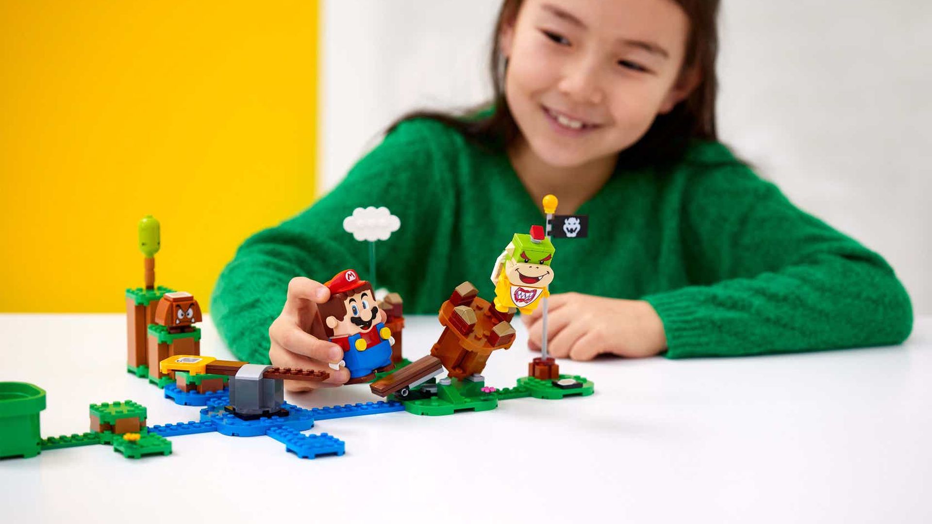 A girl playing with Lego's new Super Mario collection.