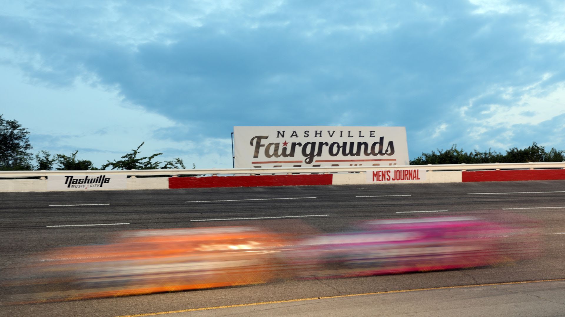 Drivers at Nashville Fairgrounds Speedway speed past the camera on July 17, 2021.