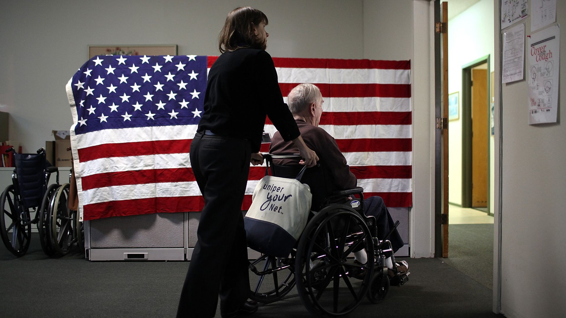 Someone pushing a wheelchair