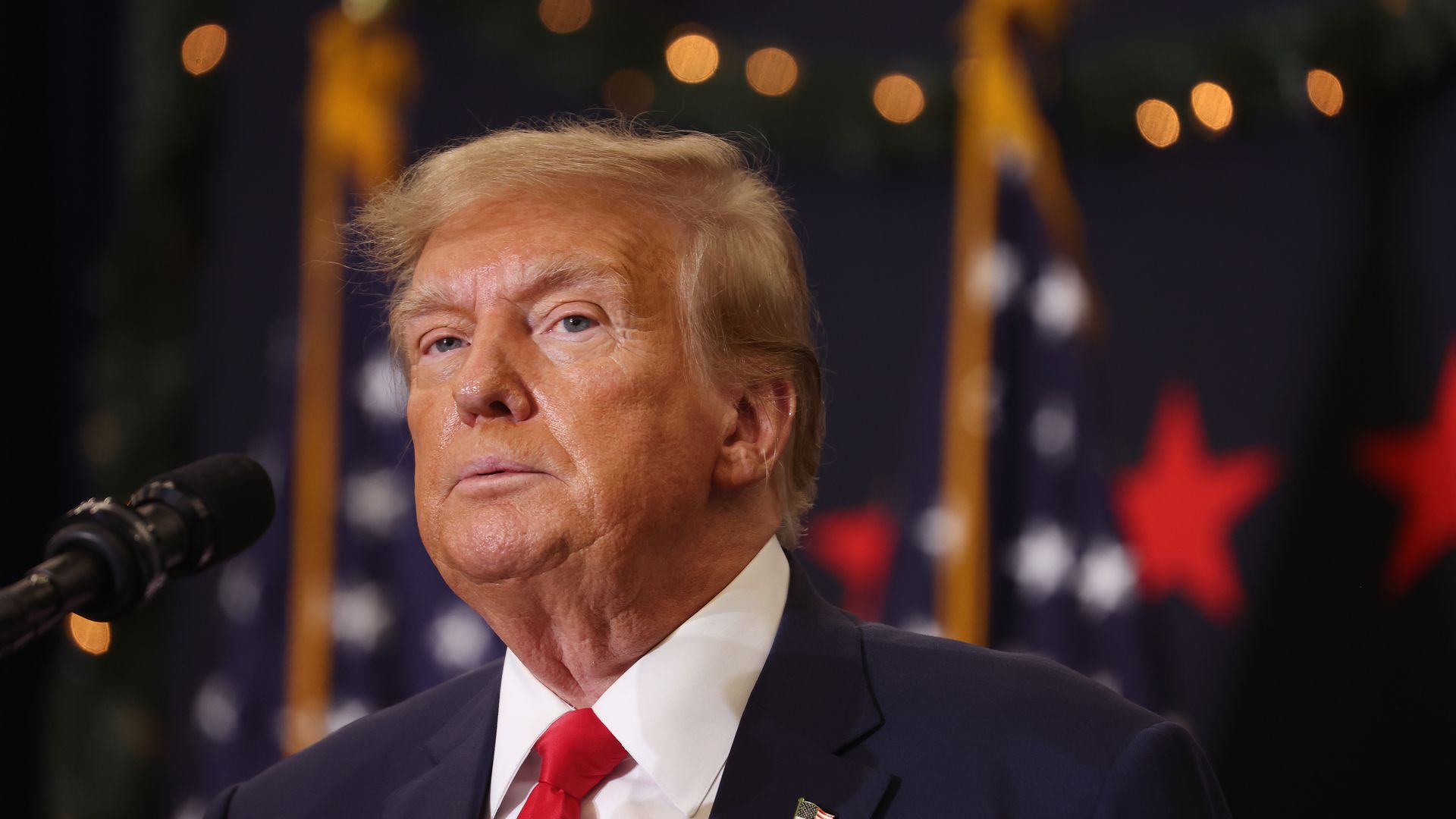 Republican presidential candidate and former U.S. President Donald Trump looks on during a campaign event on December 19, 2023 in Waterloo, Iowa. 