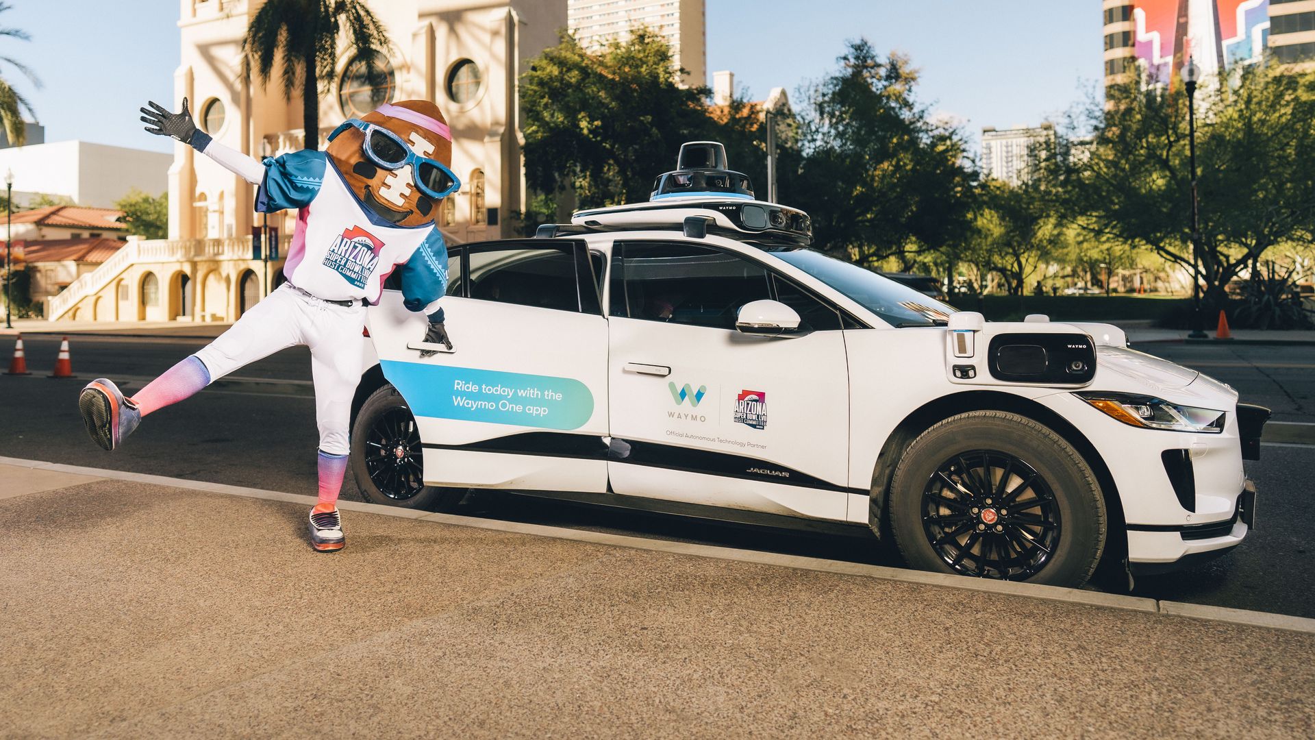 A Waymo driverless car with the Super Bowl mascot.