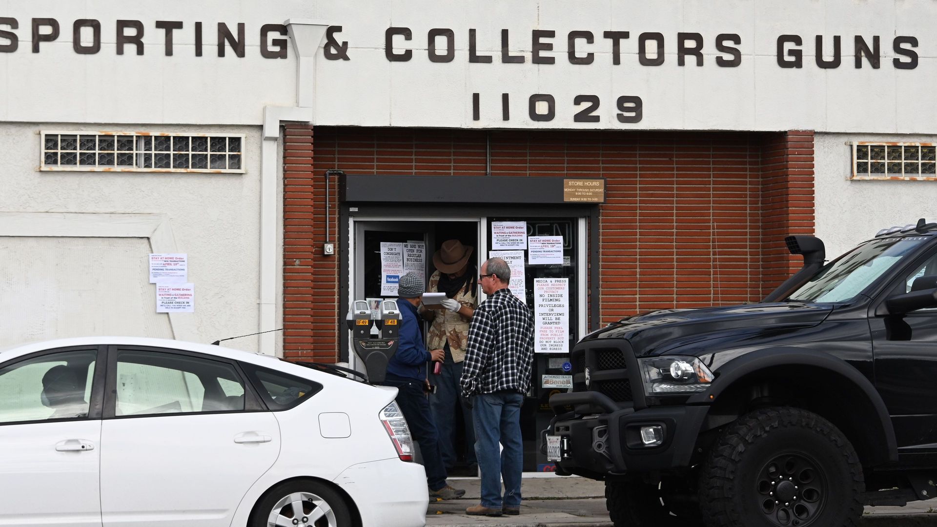 People wait for their appointment time to enter Martin B. Retting gun shop in Culver City, California