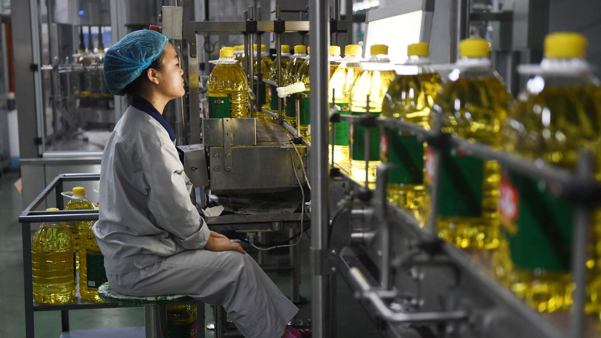 A worker monitors soybean oil production at a factory in northern China.