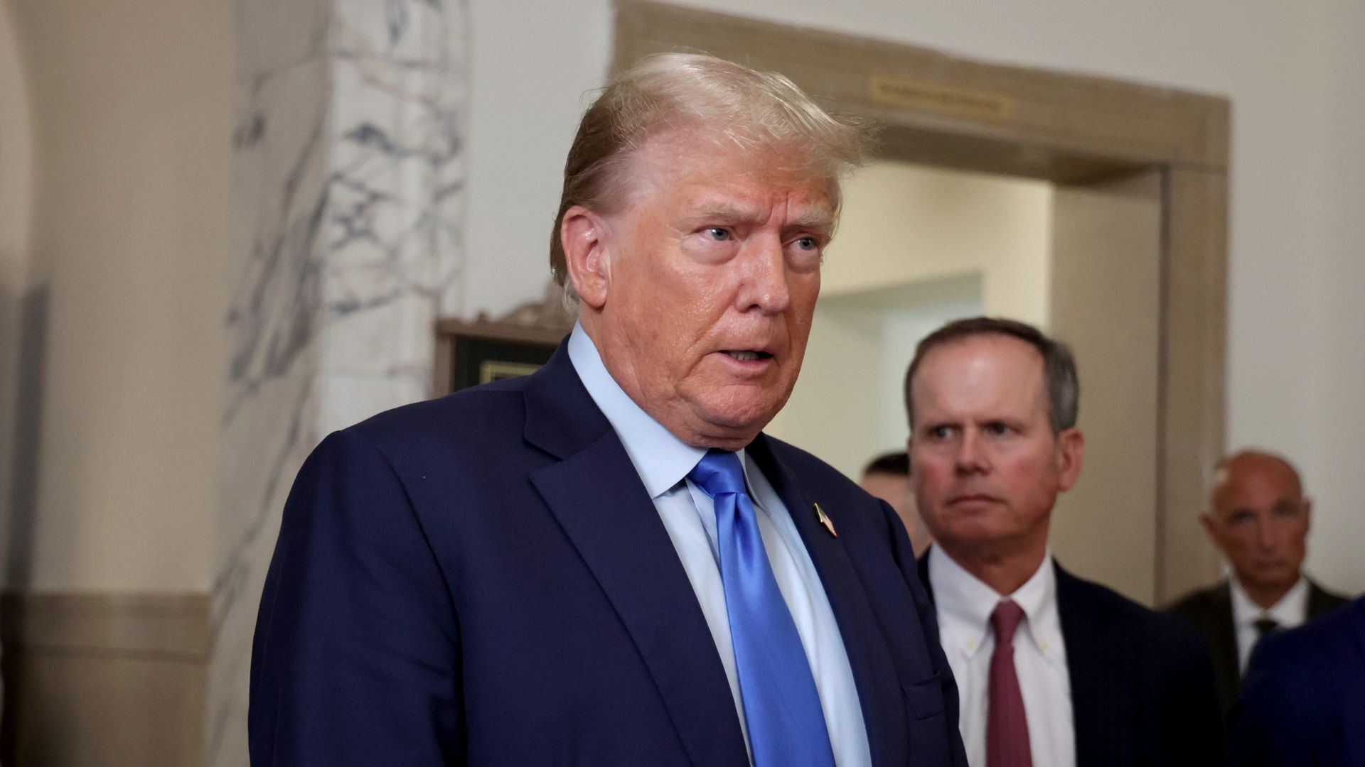 A visible upset former President Donald Trump speaks to the News Photographers posted outside Court Room 300 at Manhattan Supreme Court Monday October 2, 2023. 